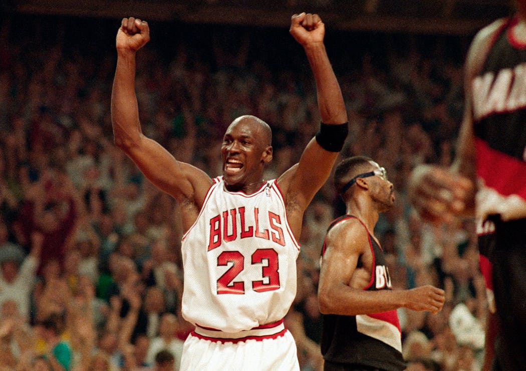 Michael Jordan celebrates the Bulls win over the Portland Trail Blazers in the NBA Finals in Chicago.