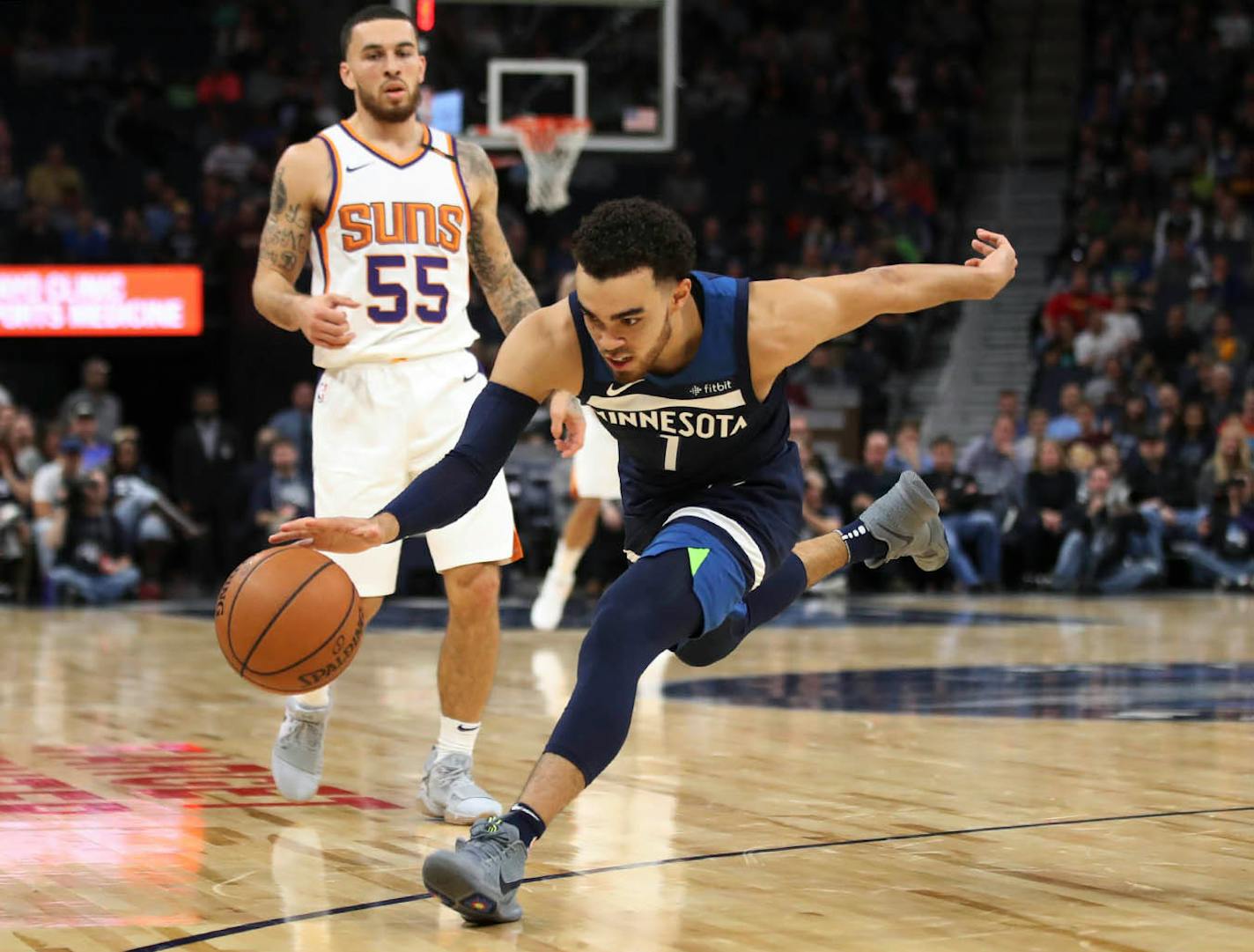 Minnesota Timberwolves guard Tyus Jones (1) stole a pass from Phoenix Suns guard Mike James (55) at Target Center Sunday November 26, 2017 in Minneapolis , MN.