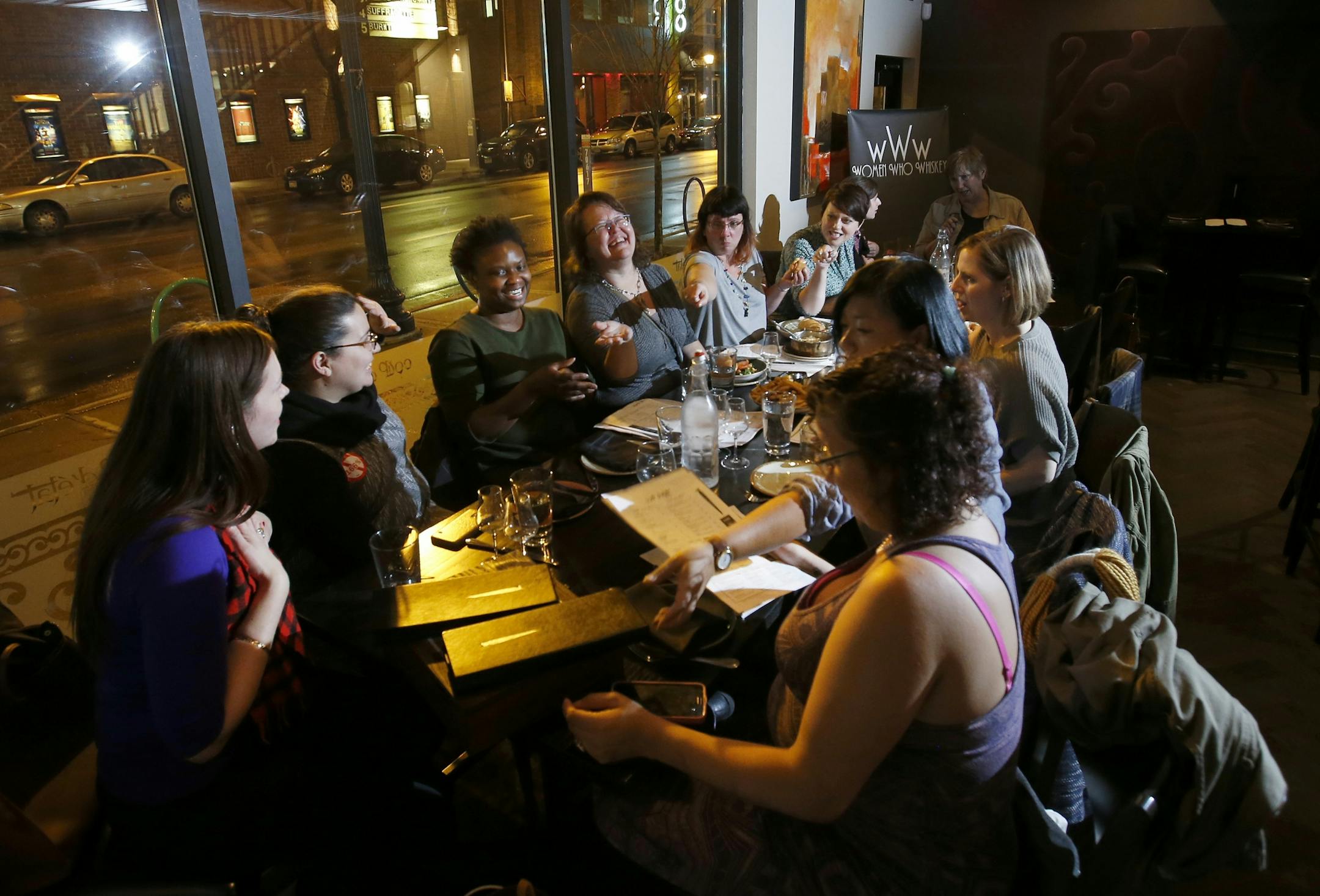 The Women Who Whiskey group gathered at coup d'etat in Minneapolis during a recent meeting.