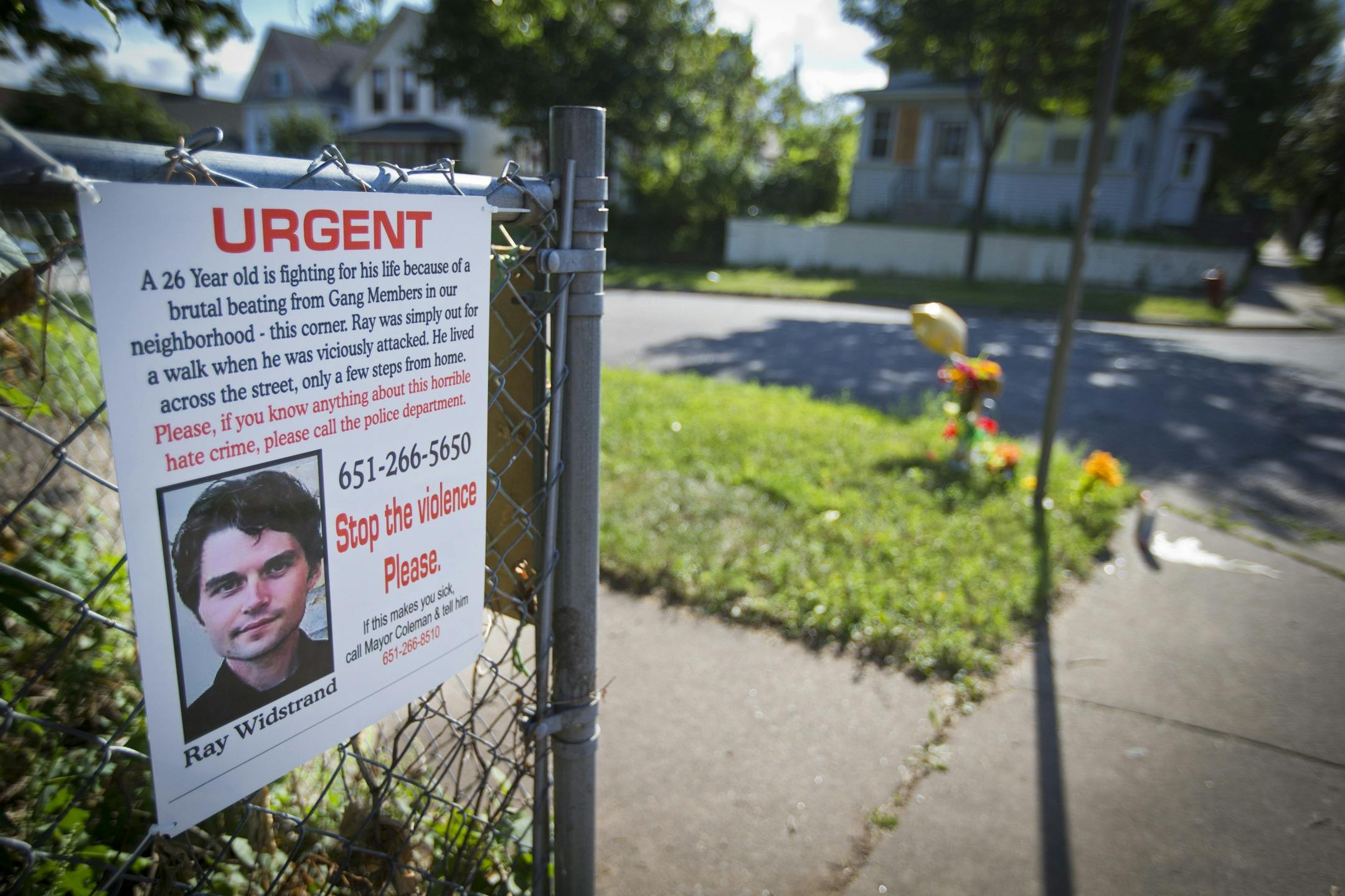 A memorial is set up, August 12, 2013, in the area of the Payne-Phalen neighborhood in St. Paul, Minnesota, where a brutal beating left a man with brain damage.
