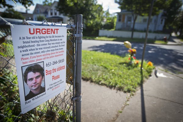 A memorial is set up, August 12, 2013, in the area of the Payne-Phalen neighborhood in St. Paul, Minnesota, where a brutal beating left a man with bra