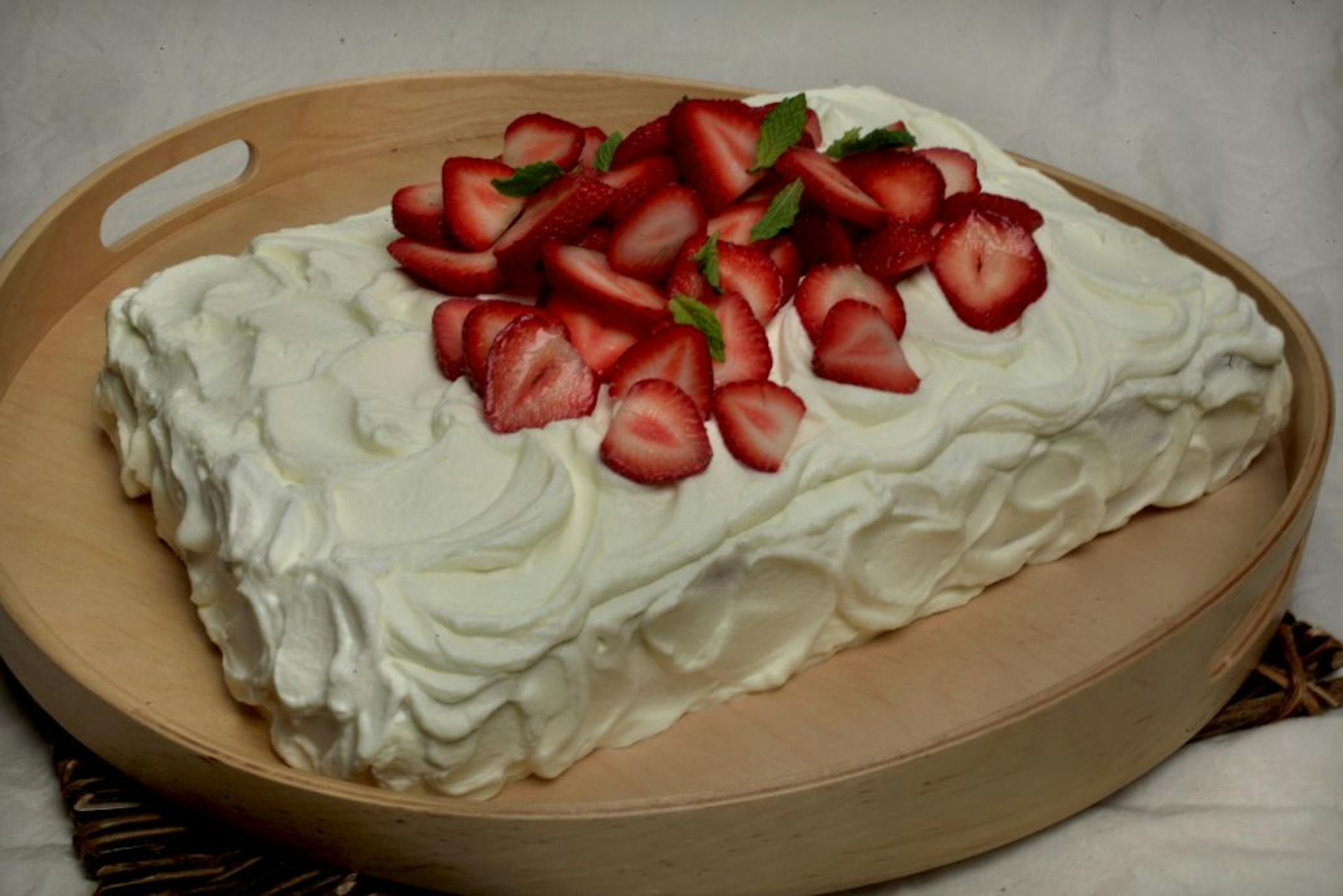 Final piece of cake. Step by step assembly of a refrigerator cake - slicing it, filling with berries, the whipping cream for filling and frosting. Minneapolis, MN. July 19, 2012.