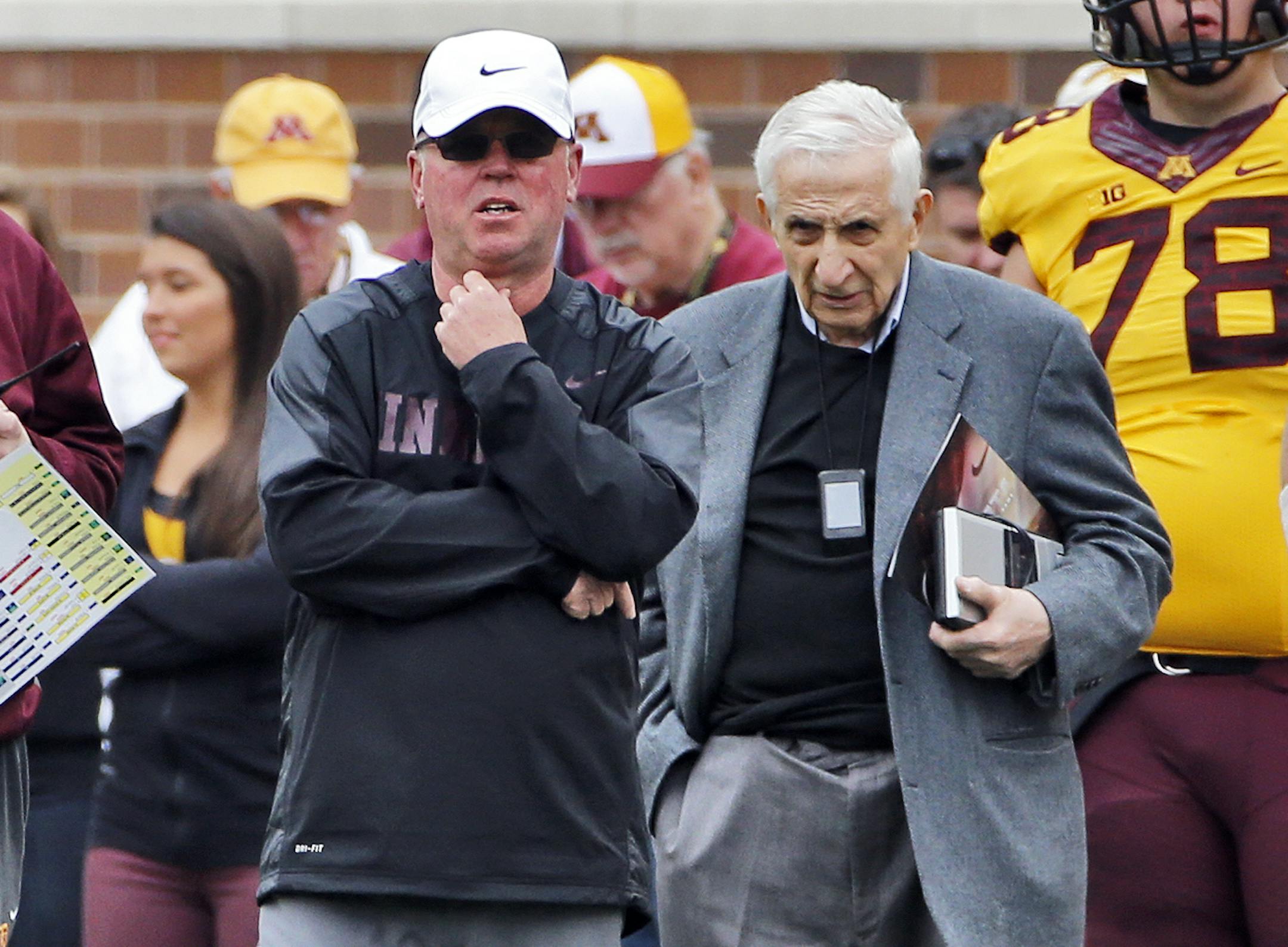 Star Tribune sports columnist Sid Hartman, right, stayed close to head coach Jerry Kill, center. ] Minnesota Gophers Spring football scrimmage. (MARLIN LEVISON/STARTRIBUNE(mlevison@startribune.com)