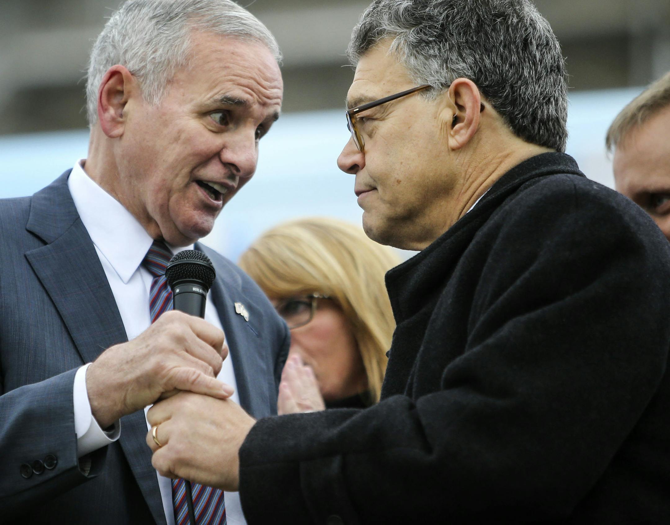 The DFL kicked off its get-out-the-vote bus tour at the State Capitol Wednesday, Oct. 29, 2014, in St. Paul, MN. Here, Senator Al Franken handed the microphone off to Gov. Mark Dayton after Franken addressed those gathered. ](DAVID JOLES/STARTRIBUNE)djoles@startribune.com DFL will be kicking off its get-out-the-vote bus tour at the Capitol