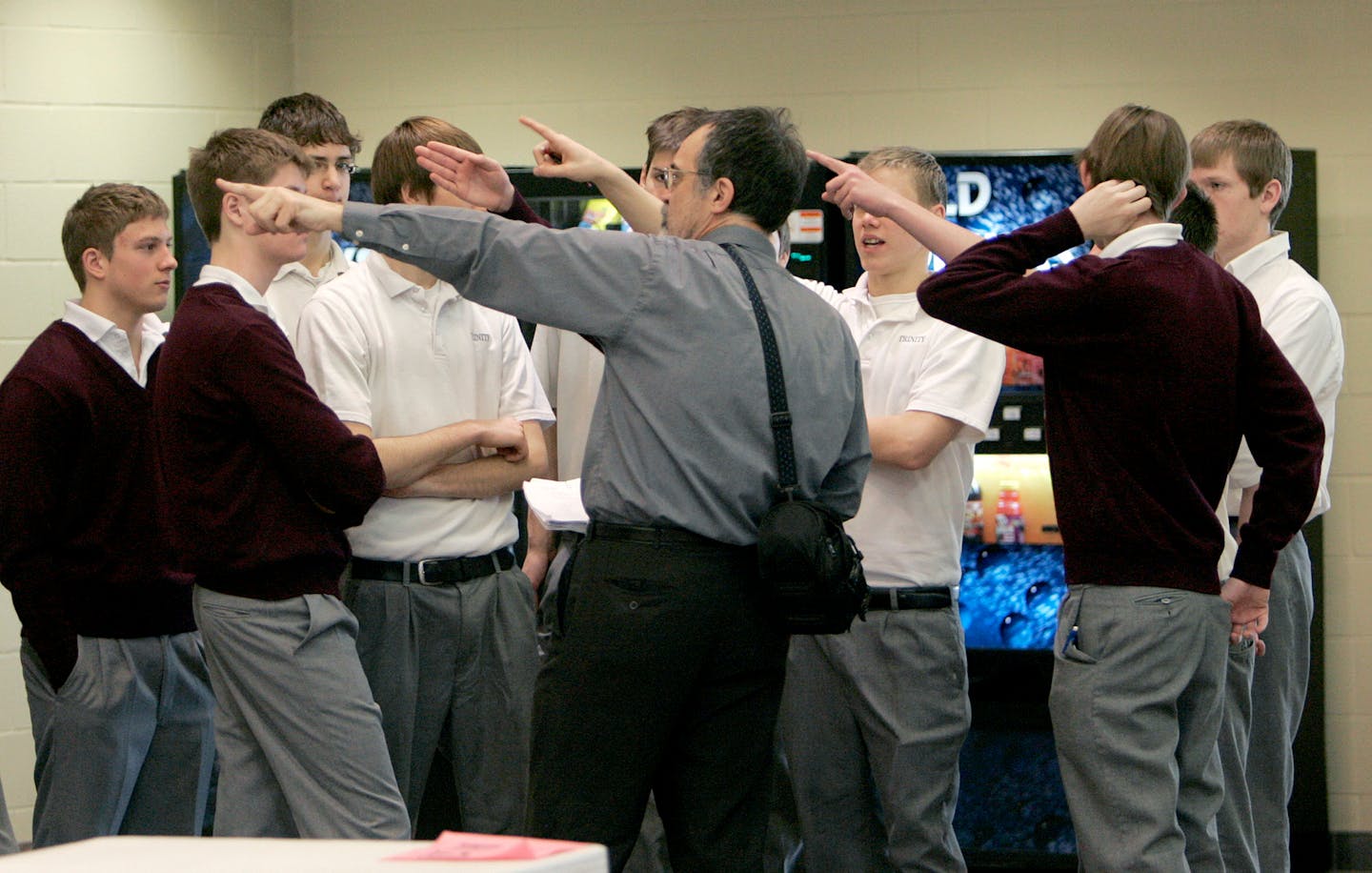 John Vogel, a math teacher, led his class of boys on a tour of their new school during the first day back to classes after Christmas break.