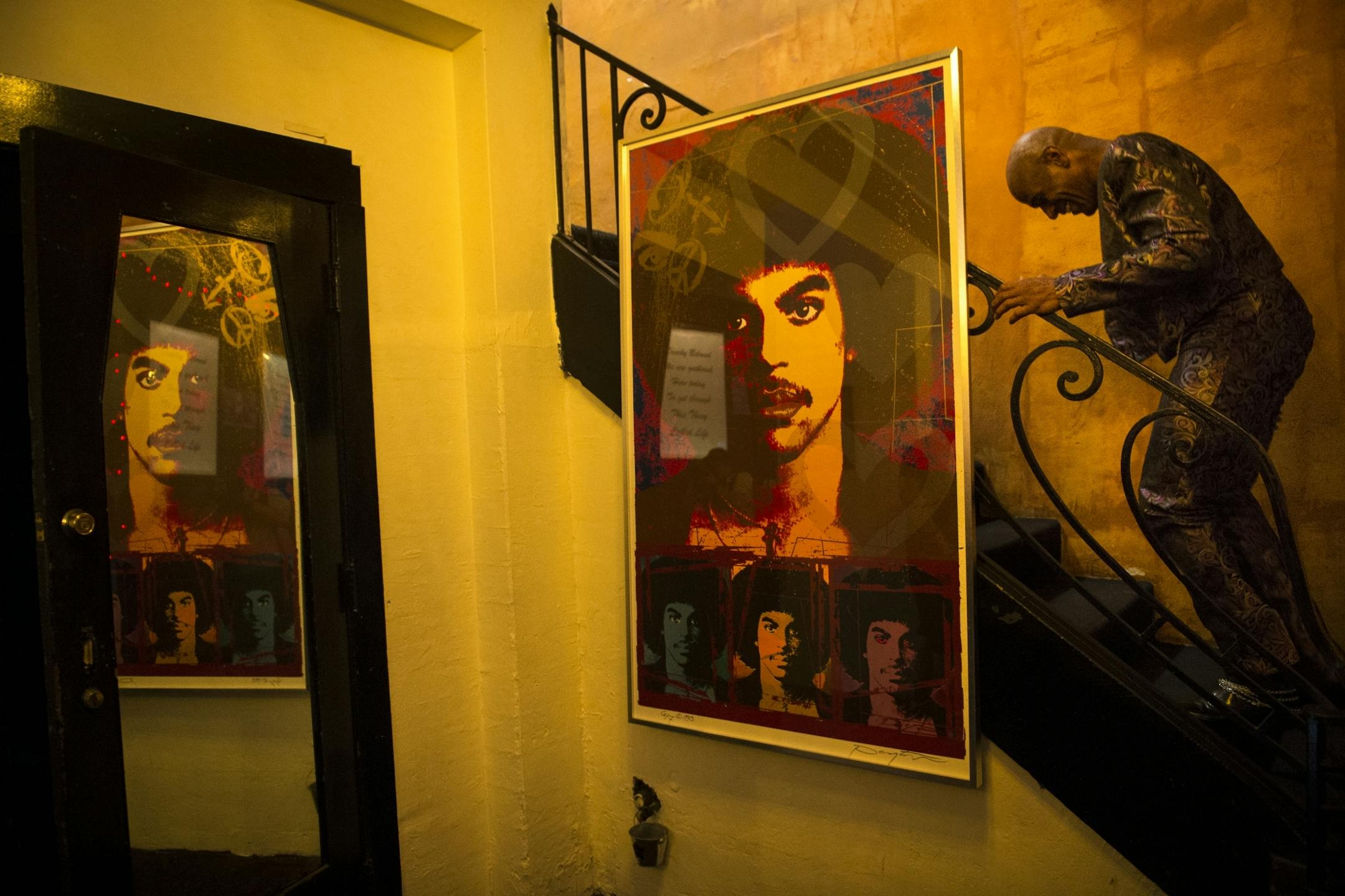 Julius Collins, the lead singer of the New Power Generation, walked up the stairs to the green room before performing at Pepito's Parkway Theater Friday night.