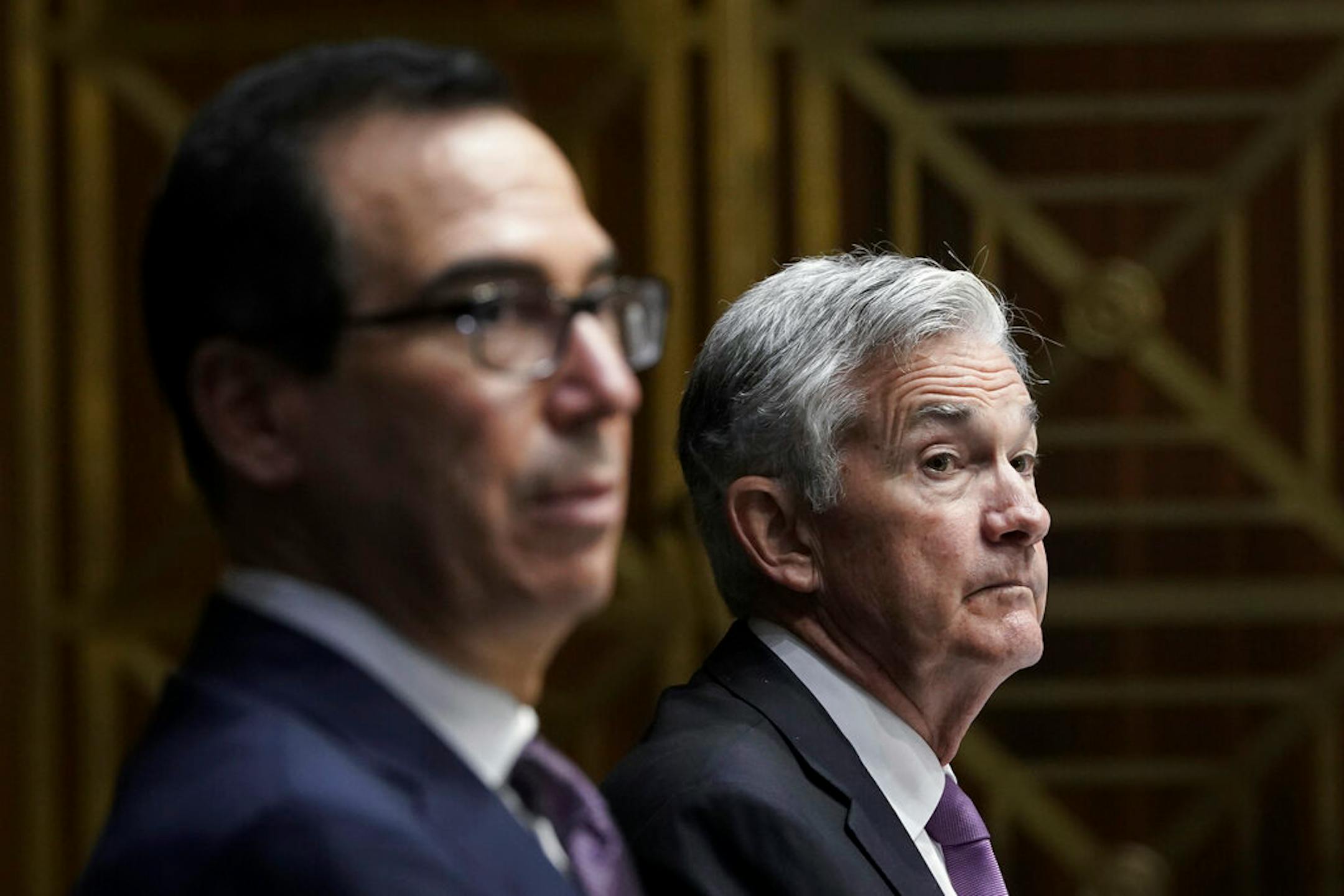 Treasury Secretary Steven Mnuchin, left, and Federal Reserve Board Chairman Jerome Powell testifies during a Senate Banking Committee hearing, Thursday Sept. 24, 2020 on Capitol Hill in Washington about the CARES Act and the economic effects of the coronavirus pandemic.