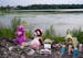 A memorial sits on the edge of Vadnais Lake on Monday, July 4, in Vadnais Heights. The bodies of three children under the age of 6 and their mother we