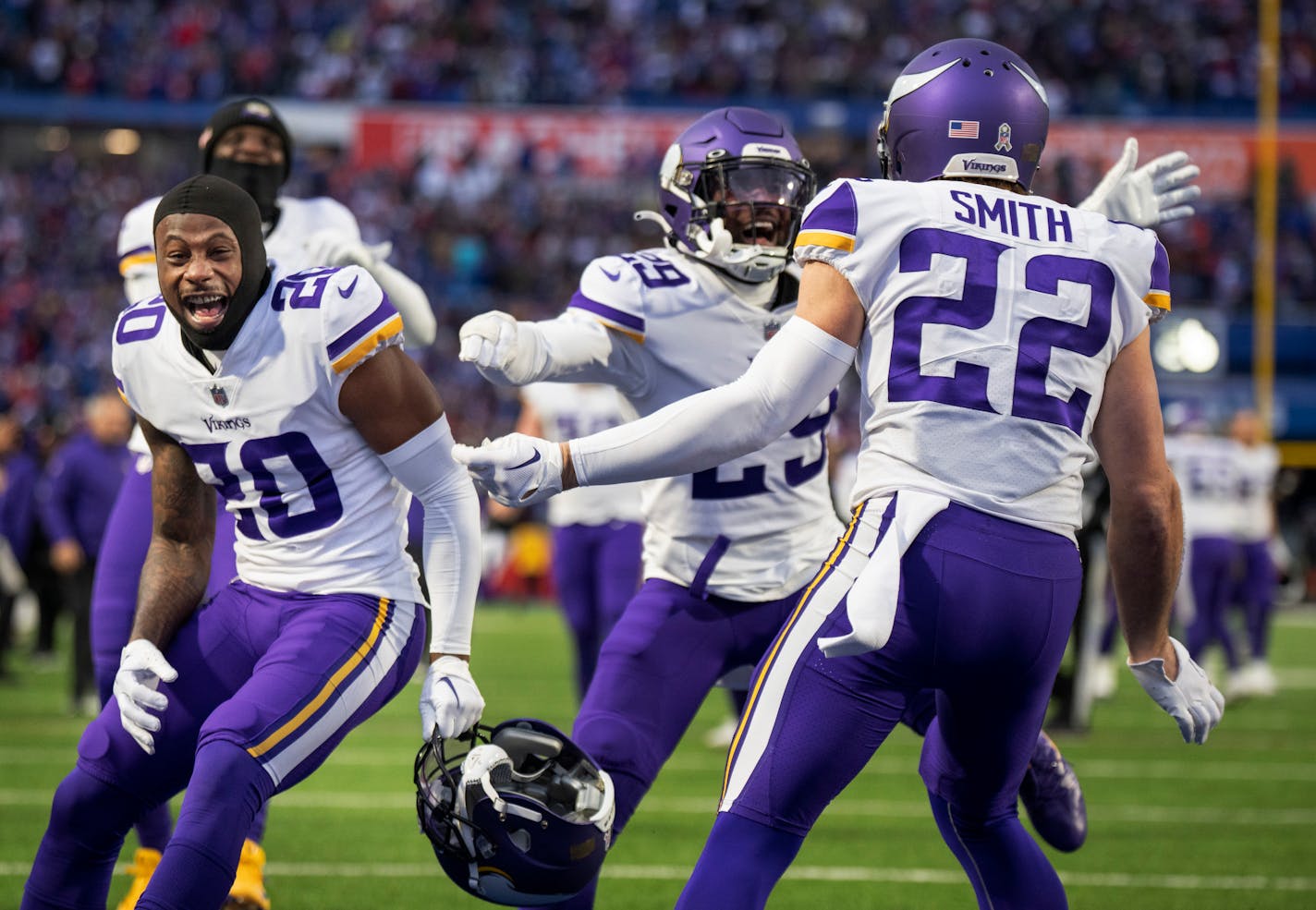 Minnesota Vikings cornerback Duke Shelley (20) left, cornerback Kris Boyd (29) and Harrison Smith (22) celebrated after linebacker Eric Kendricks (54) scored on f fumbled recovery in the fourth quarter in Orchard Park.,N.Y.Sunday November 13, 2022.