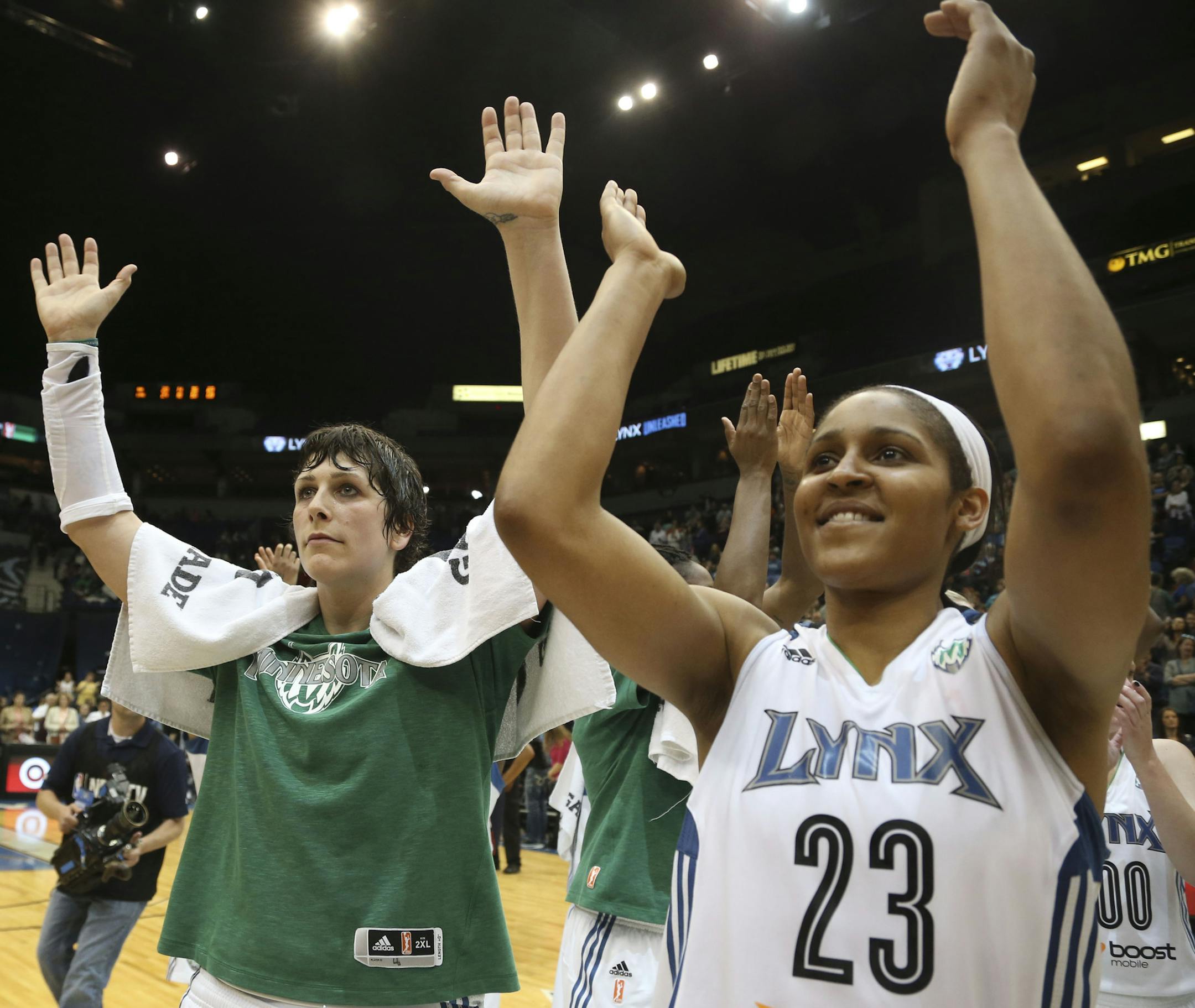Lynx Janel McCarville and Maya Moore waved to the crowd after winning the home opener at Target Center in Minneapolis Min., Saturday, June 1, 2013 Lynx won 90-74 over the Suns ] (KYNDELL HARKNESS/STAR TRIBUNE) kyndell.harkness@startribune.com