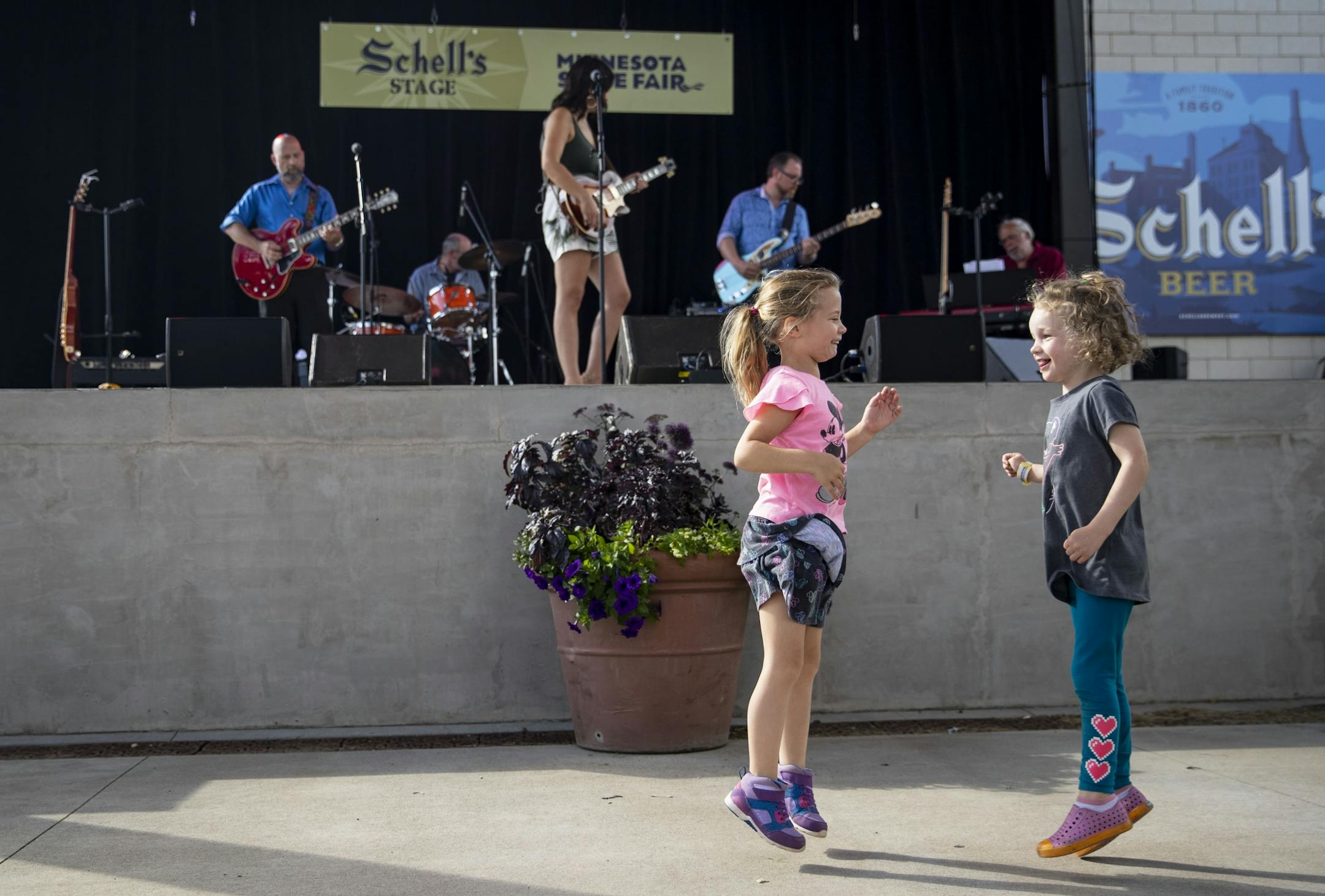 (Left) Jalaina Ellingson from Invergrove Heights danced with Ivy Gould from Minneapolis during Joyann Parker's set at the West End theater.