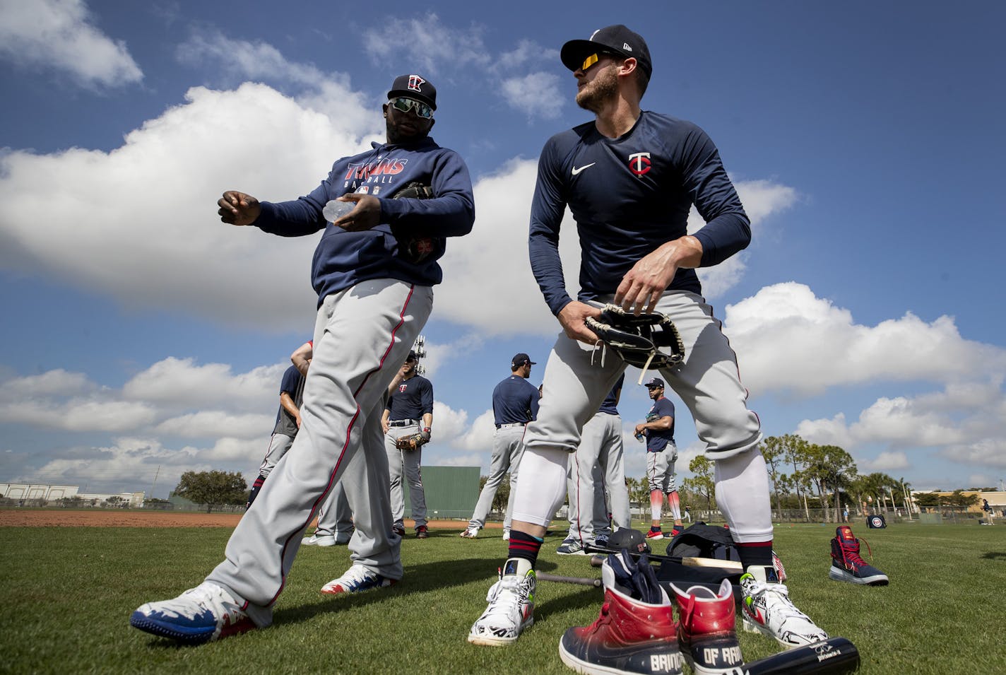 Miguel Sano and Josh Donaldson. take a break during a spring training workout in Fort Myers.