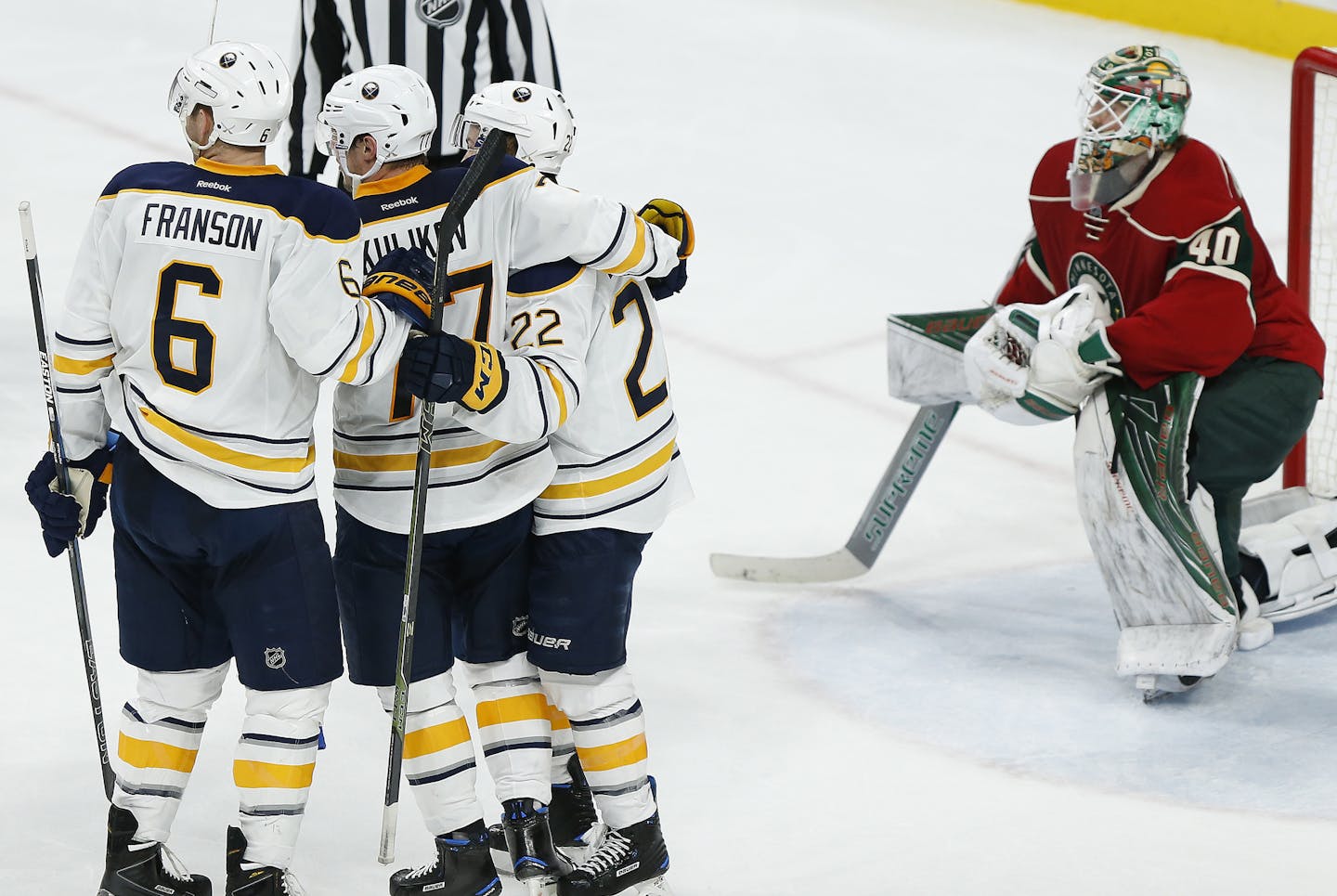 Buffalo Sabres' Cody Franson, left, Dmitry Kulikov, center, and Johan Larsson, right, celebrate after Larsson's goal in the third period of an NHL hockey game against the Minnesota Wild, Tuesday, Nov. 1, 2016, in St. Paul, Minn. The Sabres won 2-1. (AP Photo/Stacy Bengs)