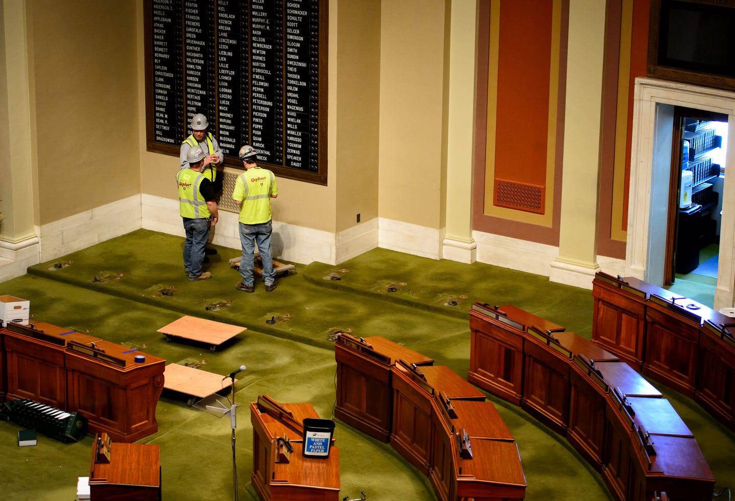 Crews removed desks in the House Chamber. ] GLEN STUBBE * gstubbe@startribune.com , Tuesday, May 19, 2015 Crews wasted no time clearing out furniture and artwork from the Minnesota State Capitol just hours after it was vacated by lawmakers who ended their session at midnight Monday.