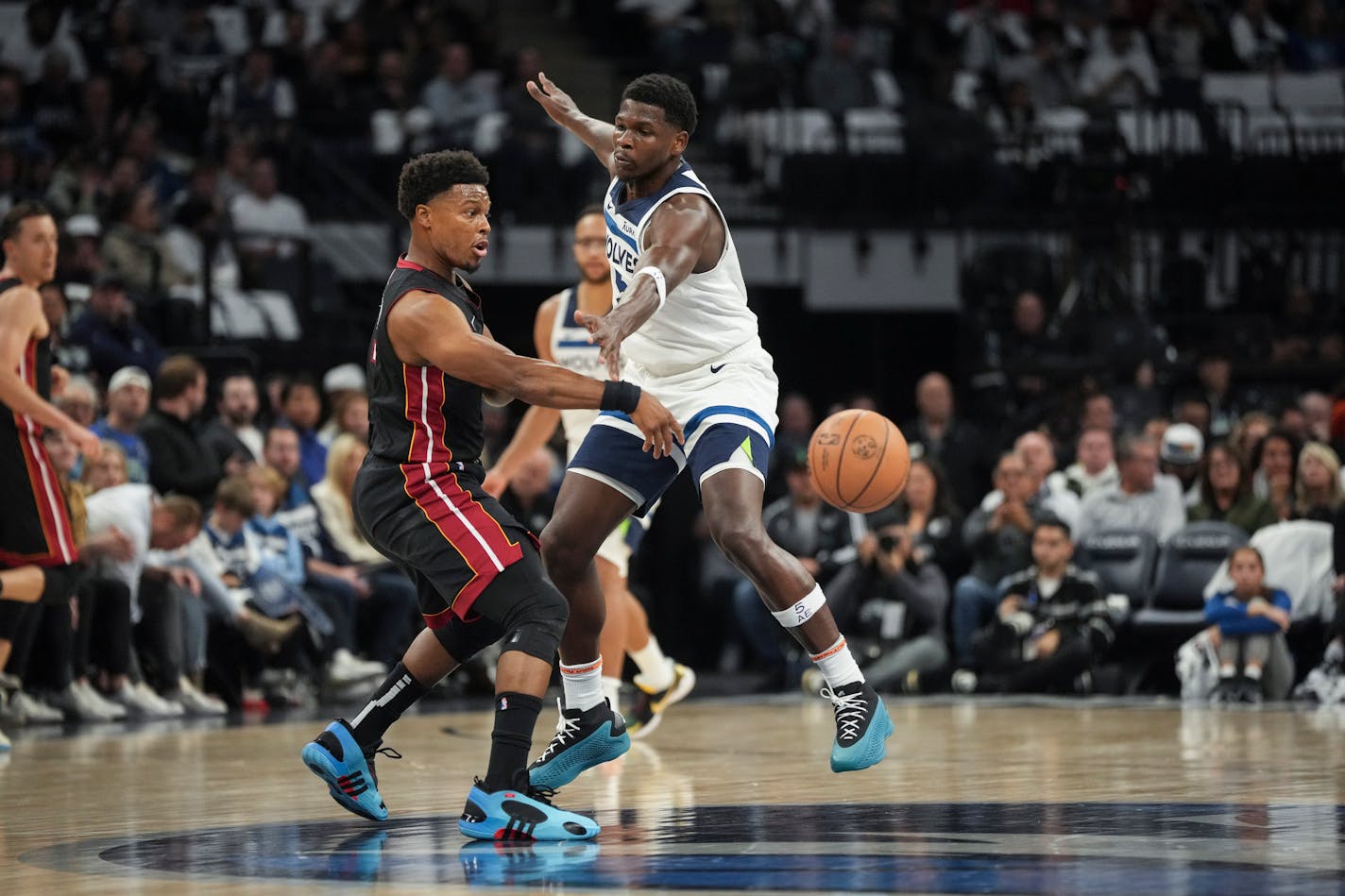 Minnesota Timberwolves guard Anthony Edwards (5) tries to stop Miami Heat guard Kyle Lowry (7) from passing in the first half. The Minnesota Timberwolves hosted the Miami Heat at the Target Center on Saturday, Oct. 28, 2023 in Minneapolis, Minn. ] RENEE JONES SCHNEIDER • renee.jones@startribune.com