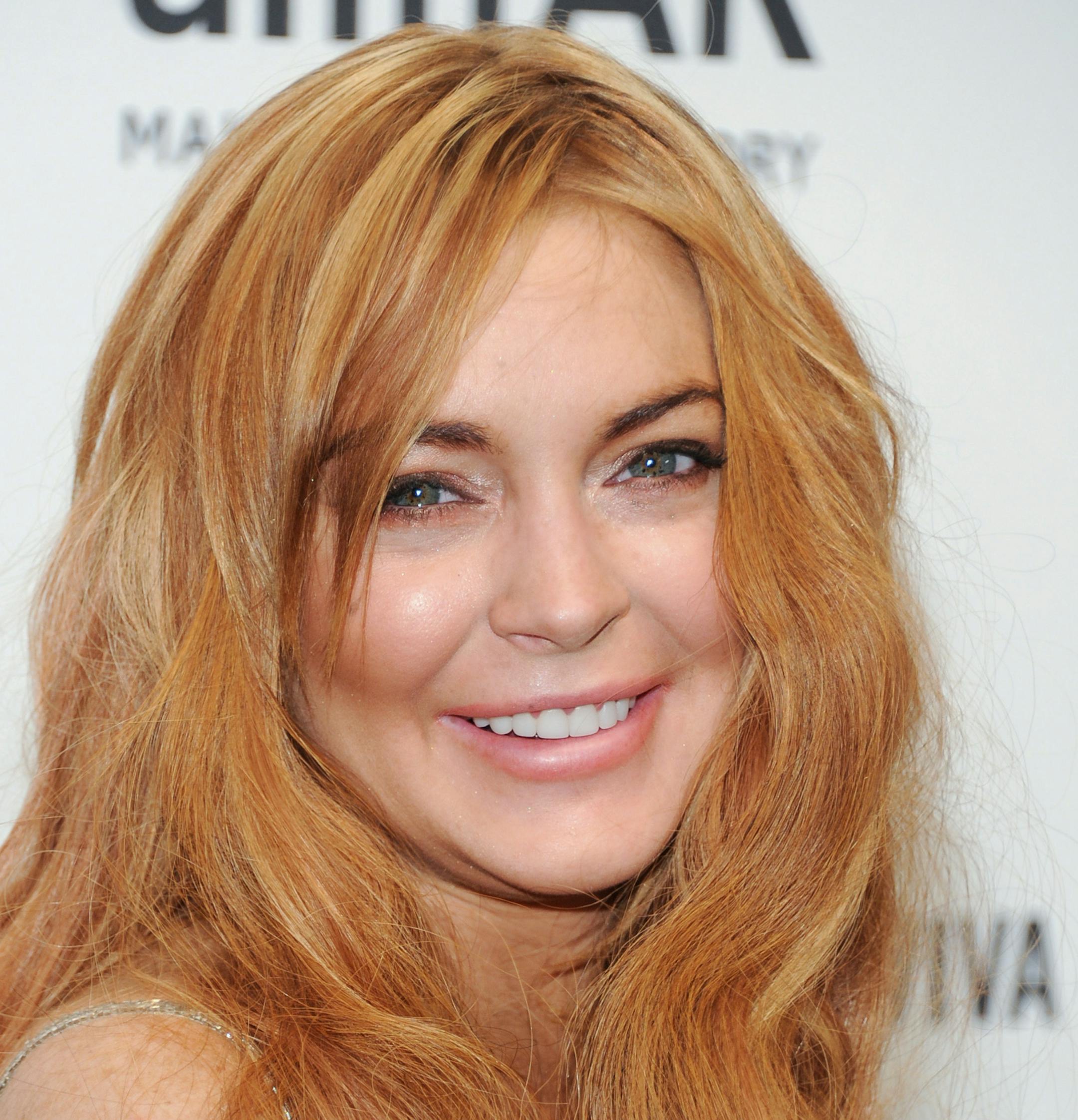 Actress Lindsay Lohan attends amfAR's New York gala at Cipriani Wall Street on Wednesday, Feb. 6, 2013 in New York. (Photo by Evan Agostini/Invision/AP) ORG XMIT: MIN2013021814122230