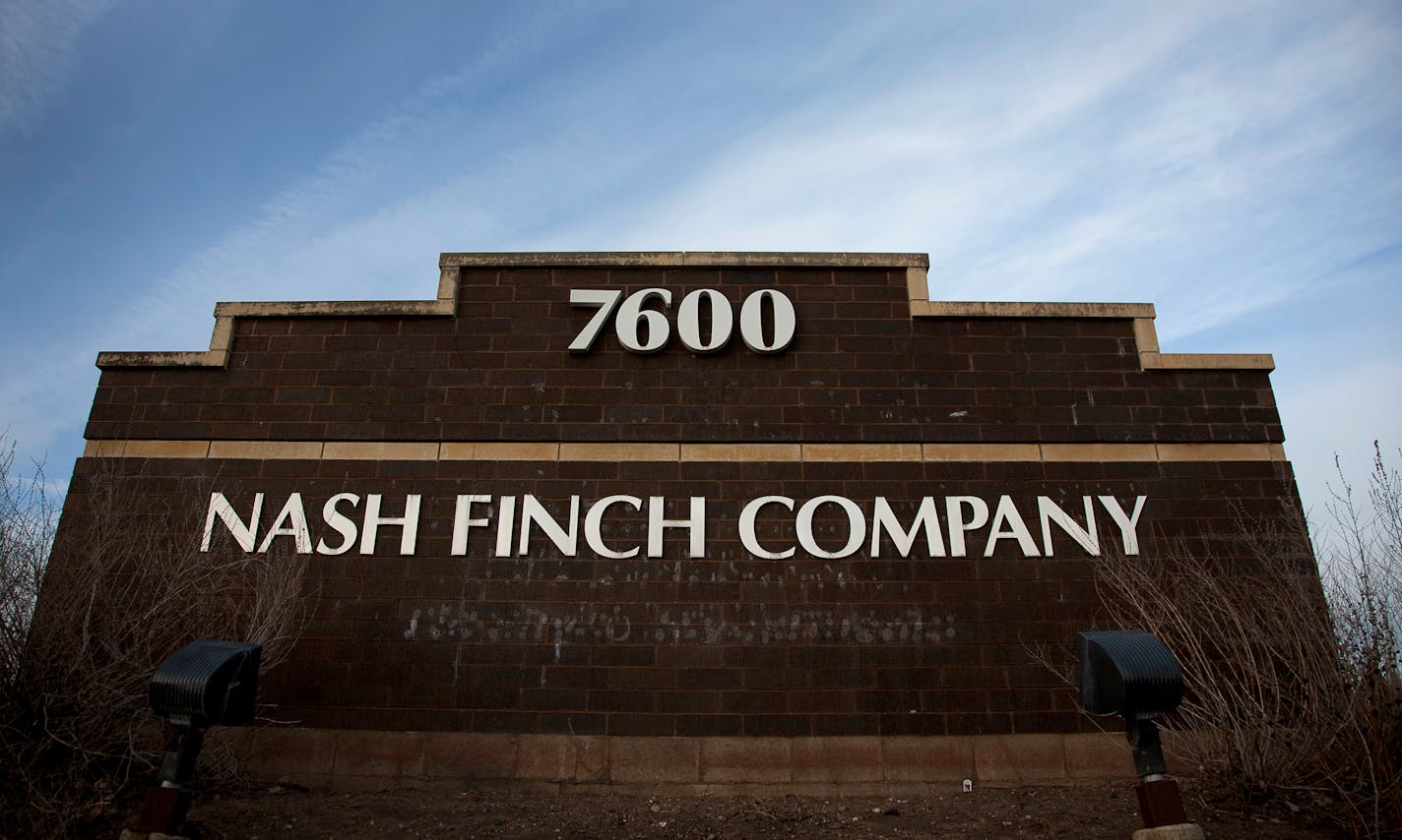 Nash Finch Co. signage is displayed outside of the company's headquarters in Edina, Minnesota, U.S., on Wednesday, Dec. 28, 2011. The economy in the Minneapolis area grew moderately in 2011, with strong growth in the agriculture, energy, and mining sectors and modest growth in consumer spending, tourism, residential and commercial construction, according to a report by the Federal Reserve Board. Photographer: Ariana Lindquist/Bloomberg