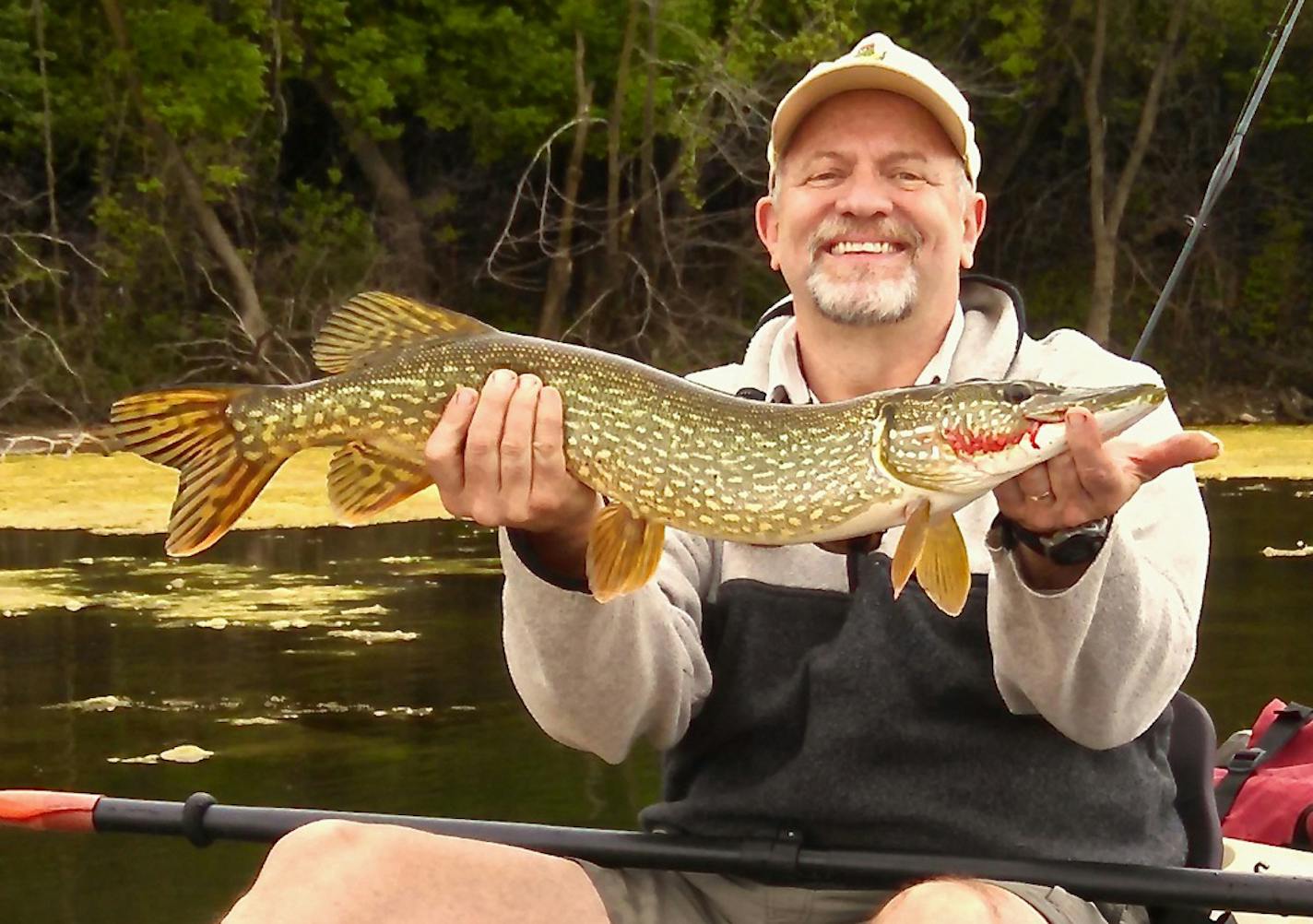 Daniel Johnson of West St. Paul with a 28-inch northern he caught and released from his kayak in Pickerel Lake. The blood on the fish is from Johnson's finger.