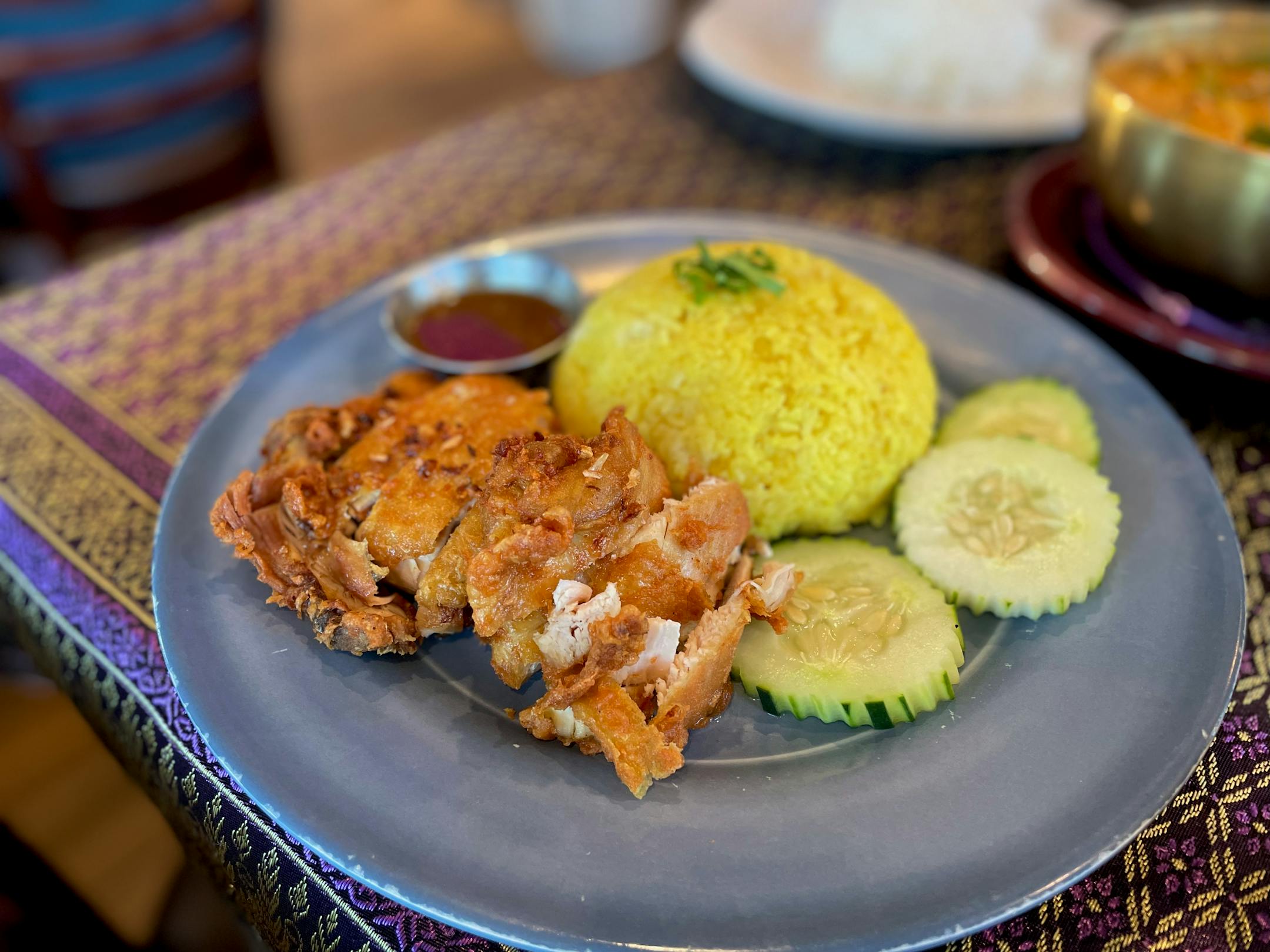 Basil Cafe Khao Mun Gai Taut - fried chicken with rice, cucumbers and house made sauce.