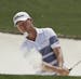 Justin Harding, of South Africa, hits from a bunker on the 18th hole during the first round for the Masters golf tournament Thursday, April 11, 2019, 