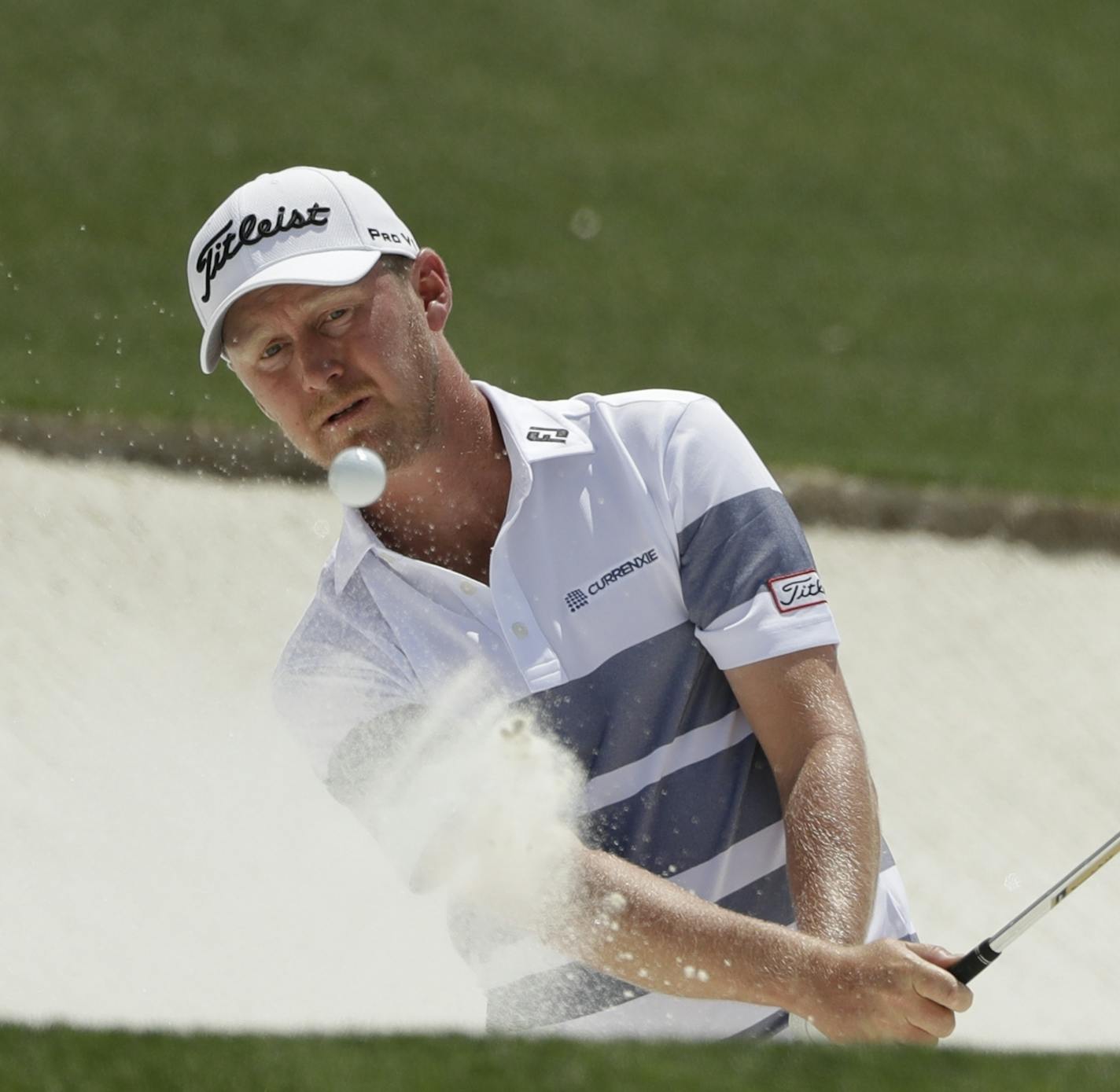 Justin Harding, of South Africa, hits from a bunker on the 18th hole during the first round for the Masters golf tournament Thursday, April 11, 2019, in Augusta, Ga. (AP Photo/Marcio Jose Sanchez)