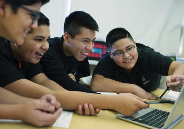 In Andres Gonzalez's science class, 8th graders , left to right, Joel Perez, Edgar Chaveras, Brian Zhagui, and Ernesto Garibay checked out tectonic fa