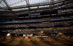Morning light shone through the roof of U.S. Bank Stadium on the dirt track set up for the first X Games events.