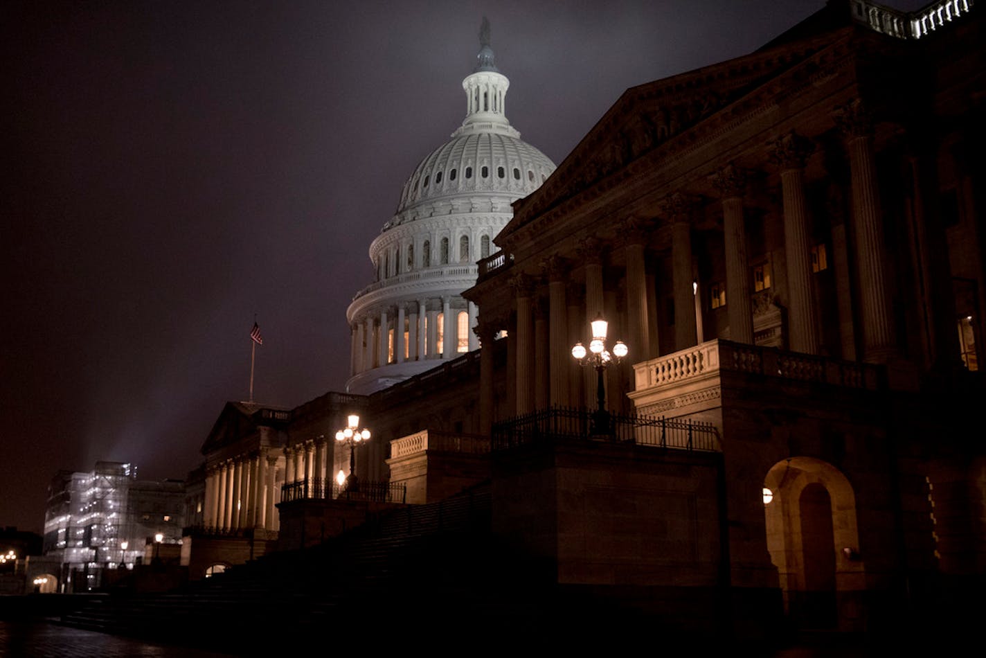 The Dome of the U.S. Capitol is visible in the early morning hours as counselors for the Judiciary and Intelligence Committees are set to testify at a hearing before the House Judiciary Committee on the impeachment of President Donald Trump, on Capitol Hill in Washington, Monday, Dec. 9, 2019. (AP Photo/Andrew Harnik)