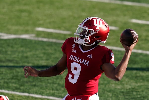 FILE - In this Oct. 24, 2020 file photo, Indiana quarterback Michael Penix Jr. (9) throws during the first half of an NCCAA college football game agai