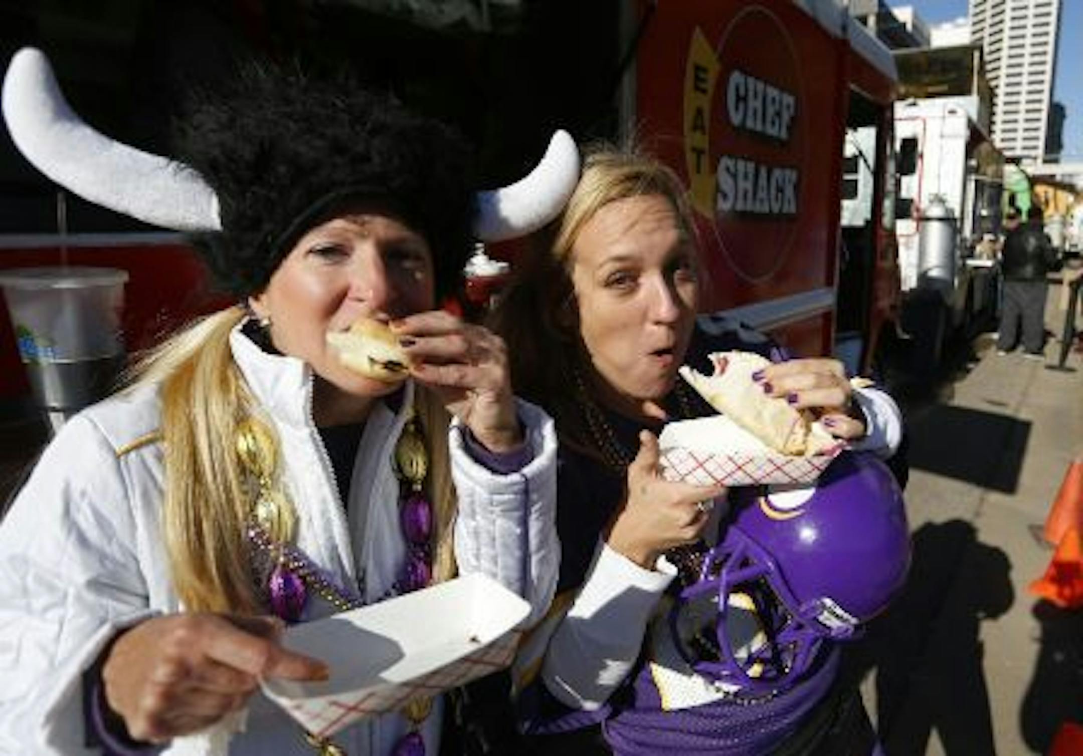 Chowing down outside the game (Photo by Richard Tsong-Taatarii)