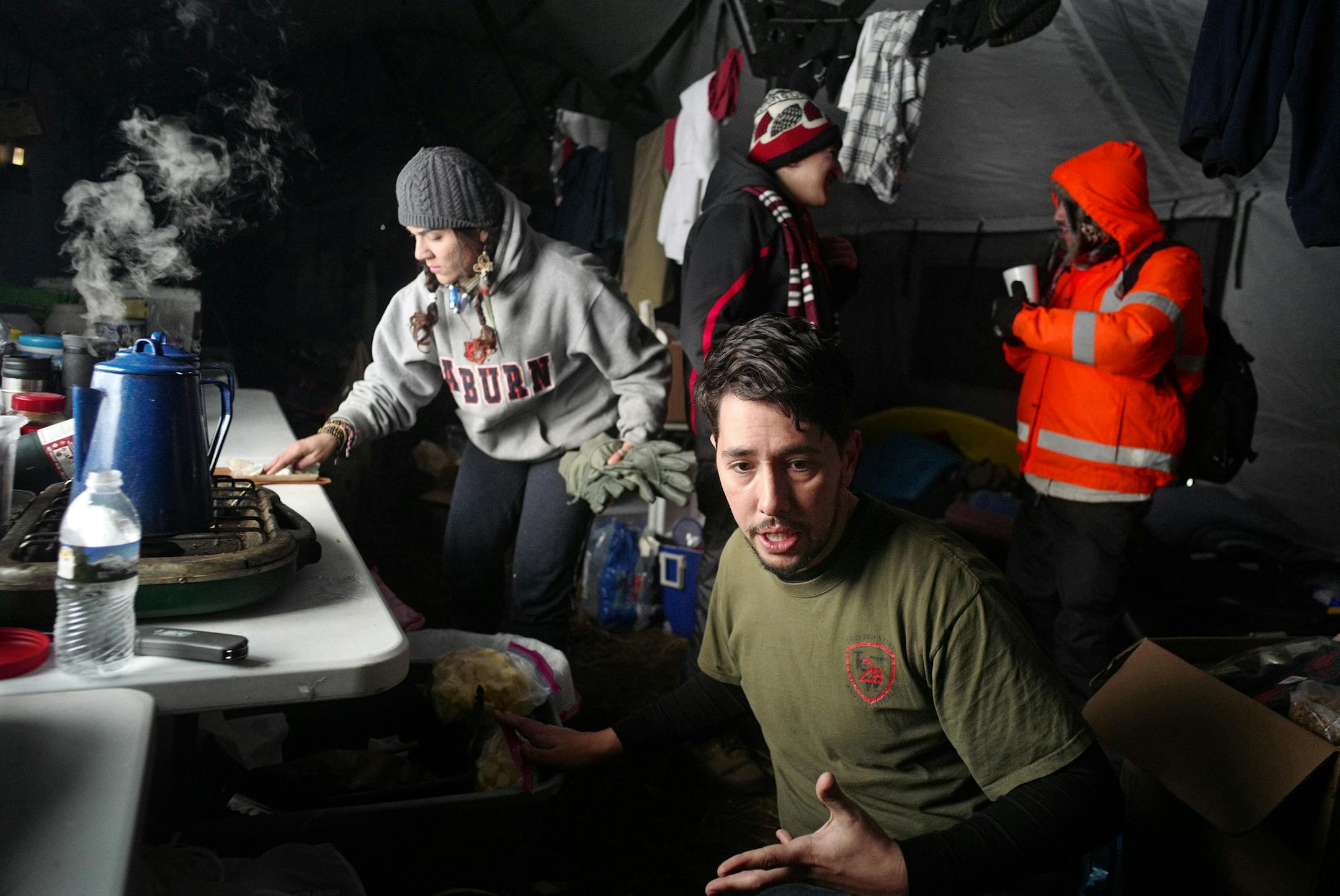 A cruel blast of winter has put one more strain on oil pipeline protesters in North Dakota. These veterans tried to stay warm and scrambled to cook food in a tent.