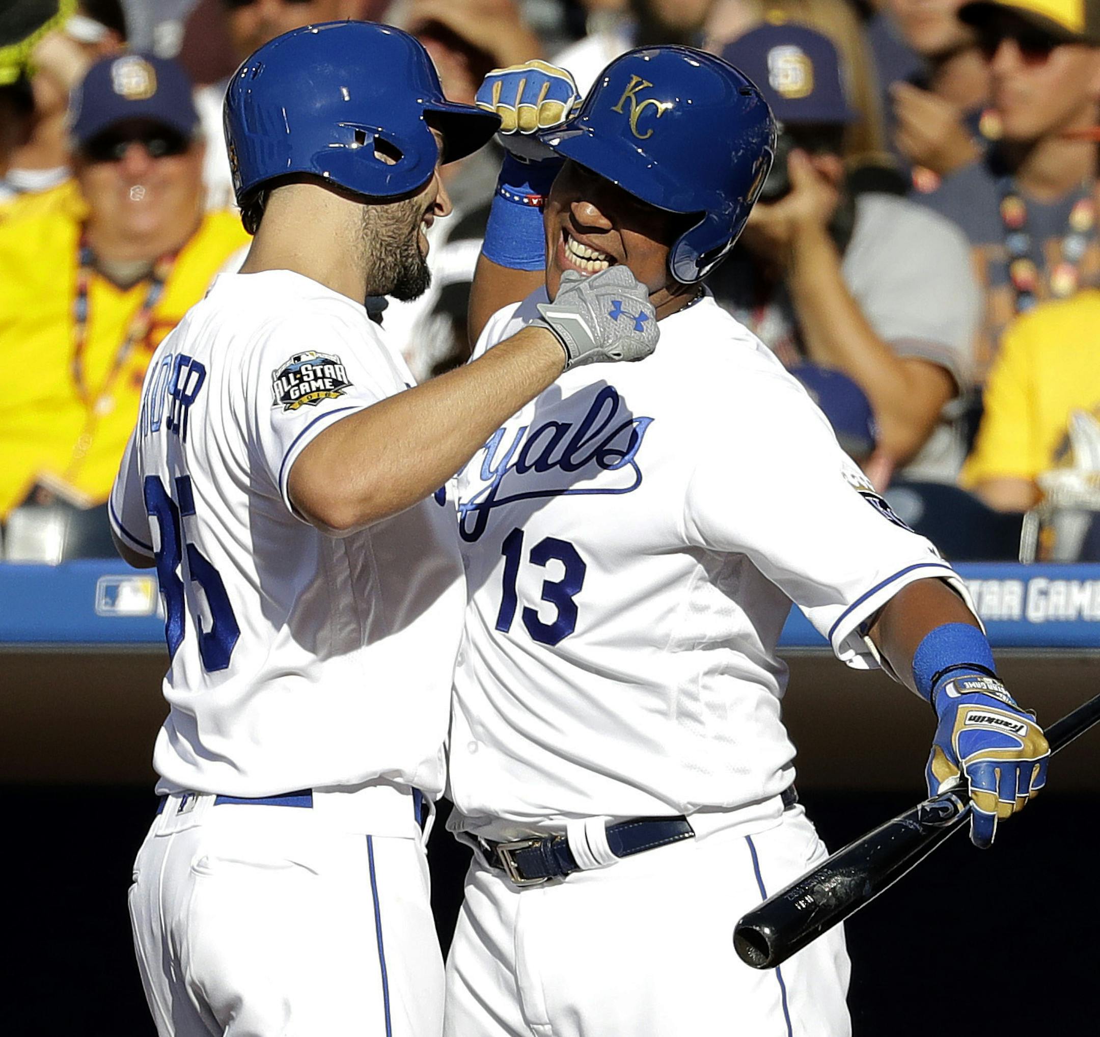 American League's Eric Hosmer, of the Kansas City Royals, left, greets teammate Salvador Perez, of the Kansas City Royals, after hitting a solo home run against the National League during the second inning of the MLB baseball All-Star Game, Tuesday, July 12, 2016, in San Diego. (AP Photo/Gregory Bull)