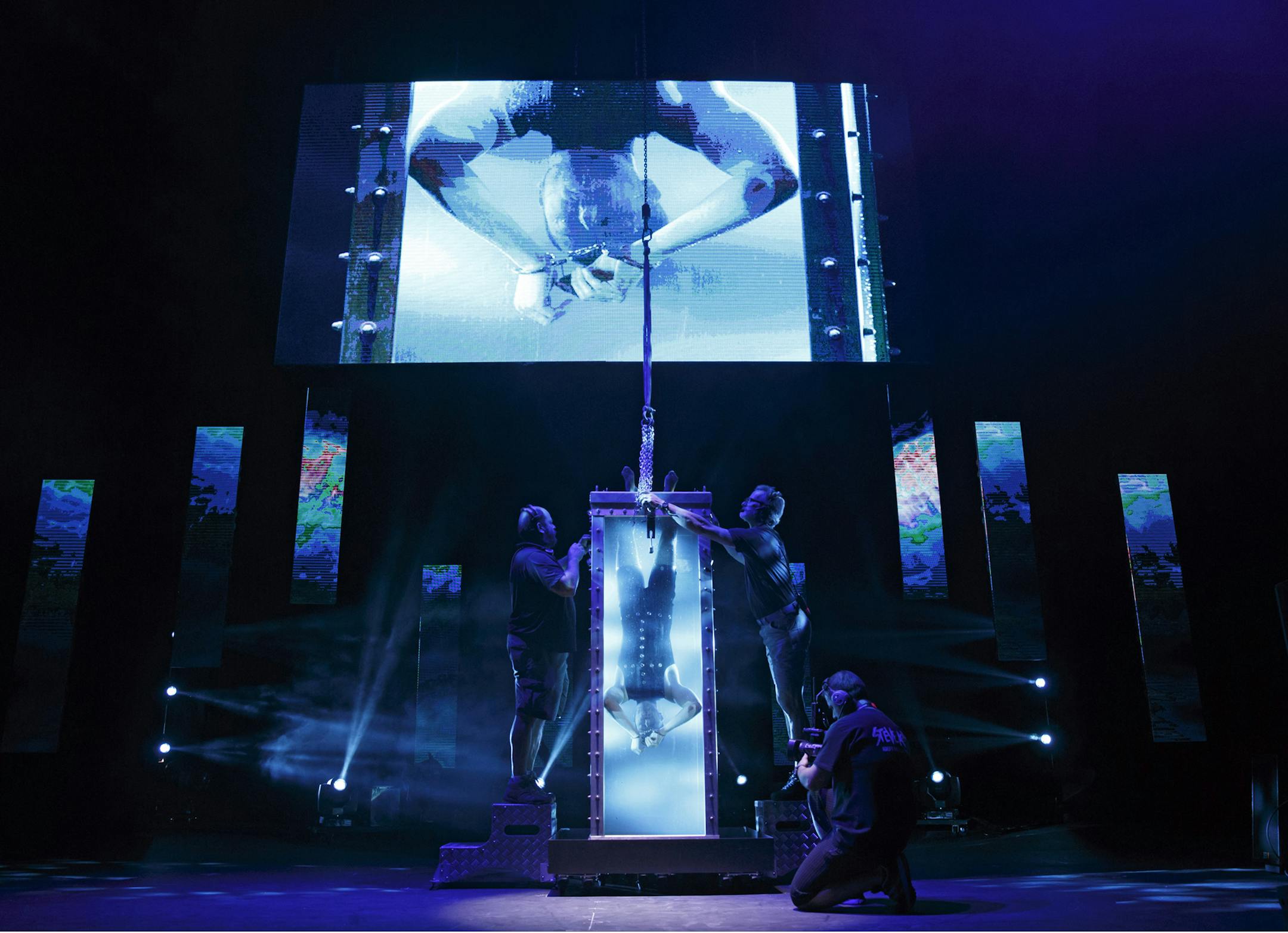 Andrew Basso escapes from a water tank. Synopsis: Seven illusionists enact mind-bending acts of magic and illusion; many have never been seen before. This critically acclaimed production is a mix of outrageous, jaw-dropping acts of grand illusion, levitation, mind-reading, disappearance and a full-view water escape. Cast List: The Manipulator, Yu Ho-Jin The Anti-Conjuror, Dan Sperry The Trickster, Jeff Hobson The Escapologist, Andrew Basso The Inventor, Kevin James The Warrior, Aaron Crow The Fu