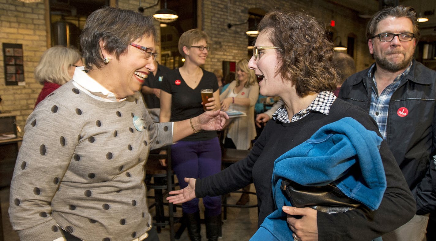 Saint Paul School Board candidate Mary Vanderwert, left, went in to hug outgoing school board member Louise Seeba Tuesday night at the DFL election party at Urban Growler. ] (AARON LAVINSKY/STAR TRIBUNE) aaron.lavinsky@startribune.com All seven of St. Paul's City Council seats are up for election, including two open wards where incumbents didn't run again. As many as three who have challenged Mayor Chris Coleman's goals and strategies have a chance of winning.The DFL held an election party at Ur