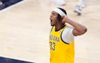 The Pacers' Myles Turner reacts after hitting a three-pointer during the second half against the Bucks on Sunday.