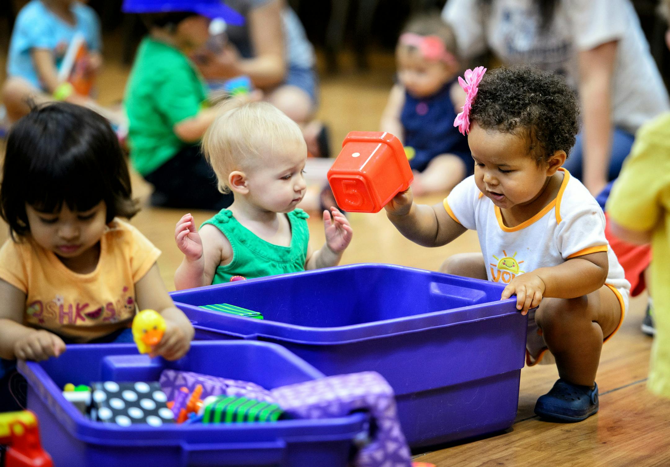 Zion Sorrell, 18 months, right, kept busy with playmates at the Woodbury Public Library. The latest American Community Survey found that 22 percent of the suburb’s residents are minorities.