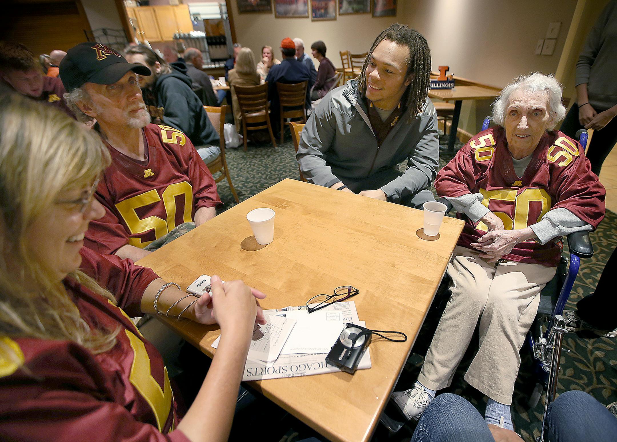 7:32 p.m. Friday: Gophers linebacker Jack Lynn, center, visited with parents Sandy, left, and Pat, along with his grandmother, Betty, before the team’s 10 p.m. curfew at the team hotel.