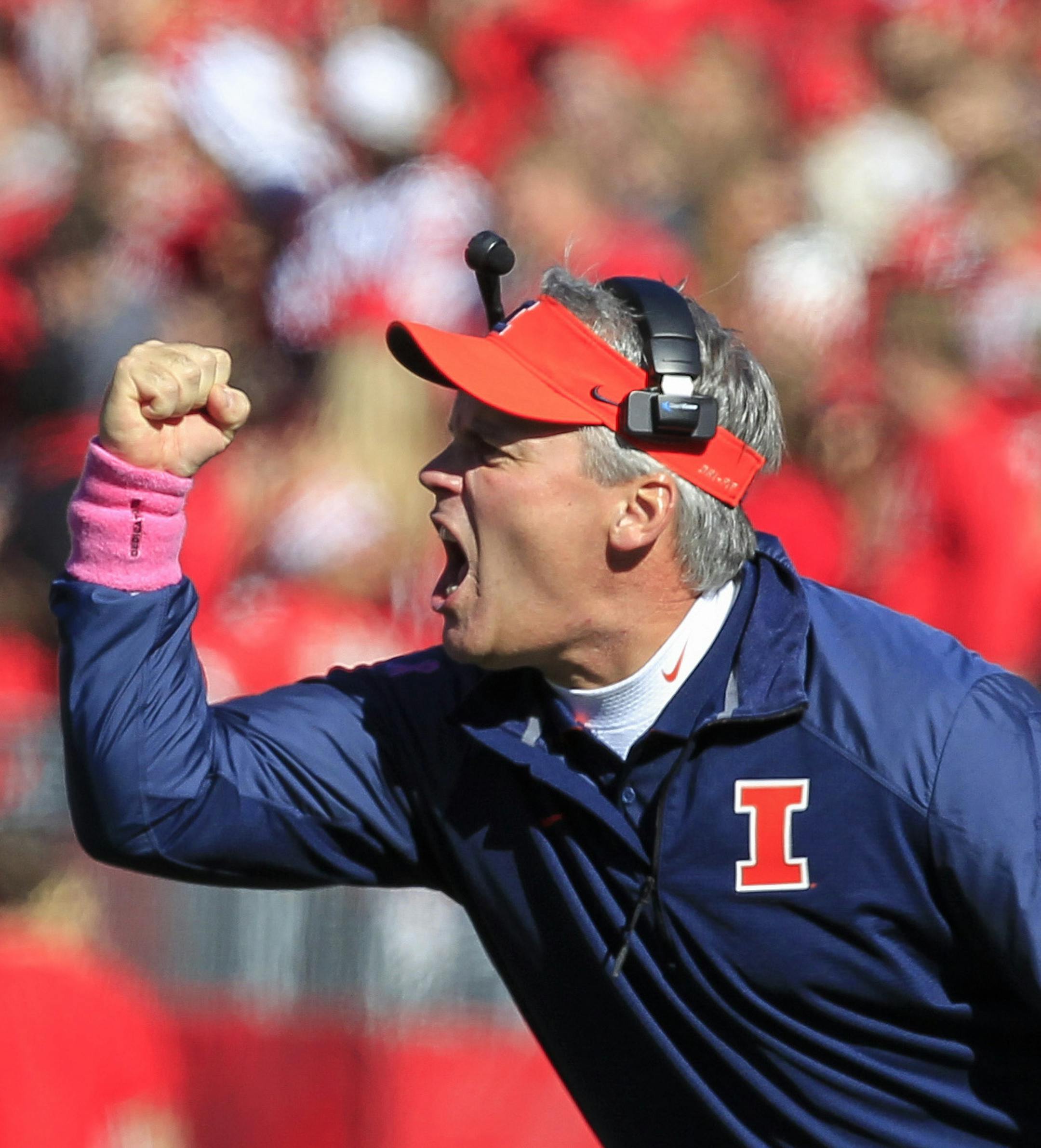 Illinois coach Tim Beckman directs his team during the first half of an NCAA college football game against Wisconsin, Saturday, Oct. 11, 2014, in Madison, Wis. Wisconsin won 38-28. (AP Photo/Andy Manis) ORG XMIT: MIN2014102218533982