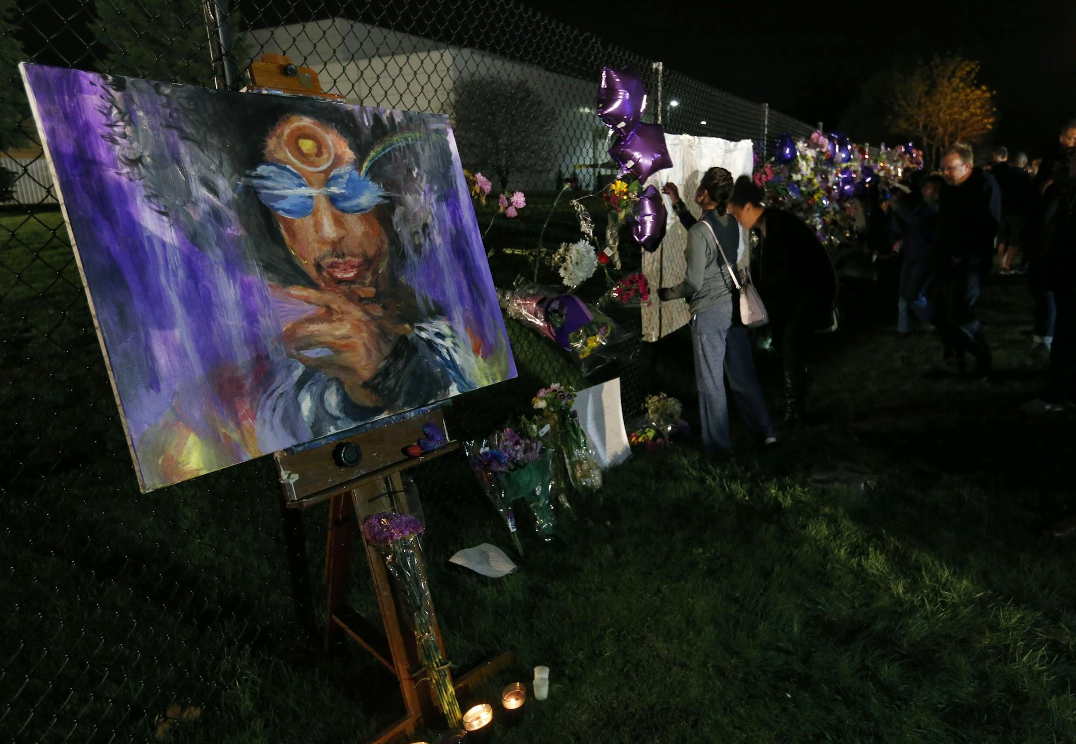 A memorial on a fence at Paisley Park Studios in Chanhassen, MN. Musician Prince was found dead at the site on Thursday morning.