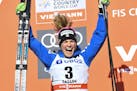 Jessica Diggins of the United States, celebrates on the podium after finishing in second place in the 10km cross country free style event of the Cross