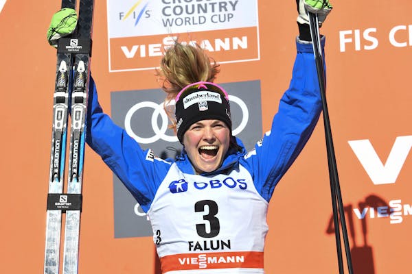 Jessica Diggins of the United States, celebrates on the podium after finishing in second place in the 10km cross country free style event of the Cross