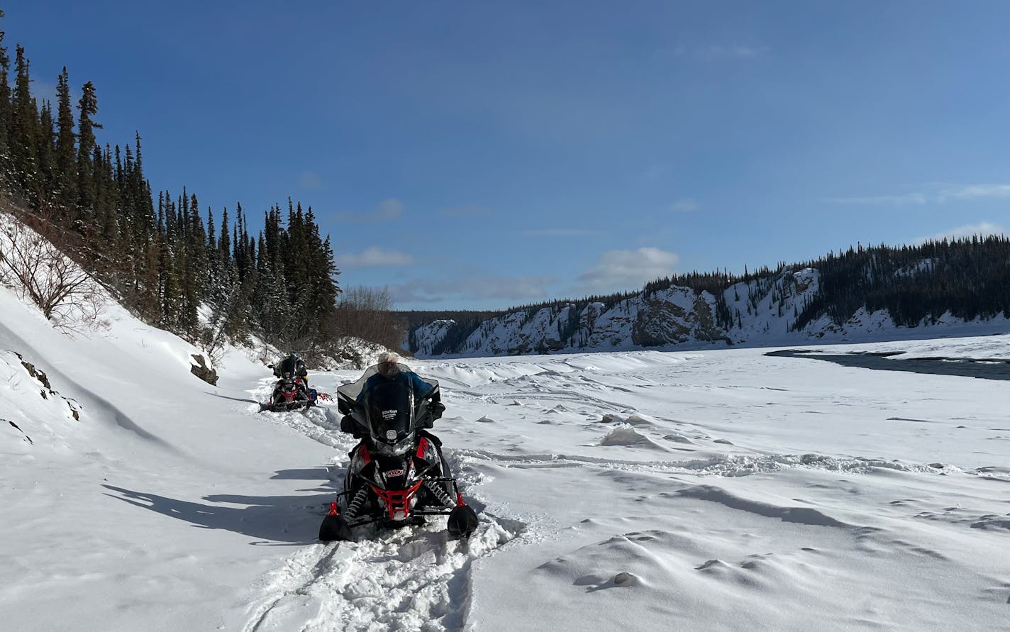 The "three old guys'' travel on the Porcupine River in Alaska, headed for Fort Yukon, a trip that was interrupted by a snowmobile fire.