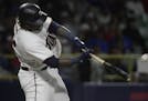 Minnesota Twins' Miguel Sano hits a home run, to tie the game in the fourteenth inning of the final game of a two-game Mayor League Series against the