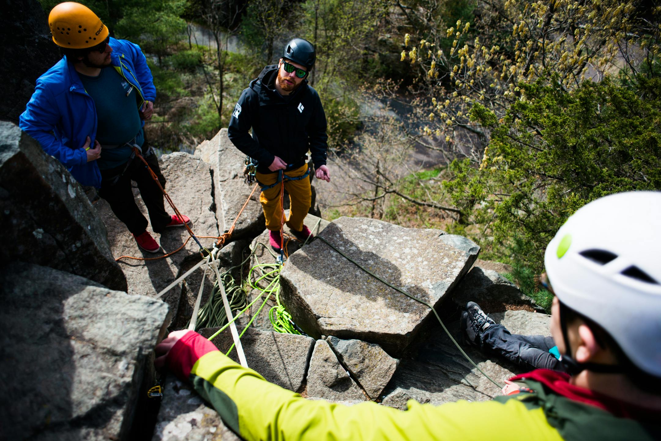 Christian Fraser, center, discussed the preparation of the ropes above a route with his fellow guides. ] Mark Vancleave - mark.vancleave@startribune.com * Vertical Endeavors Guided Adventures (VEGA) staff practiced their climbing and guiding skills on the rocks at Interstate State Park on Saturday, April 30, 2016.