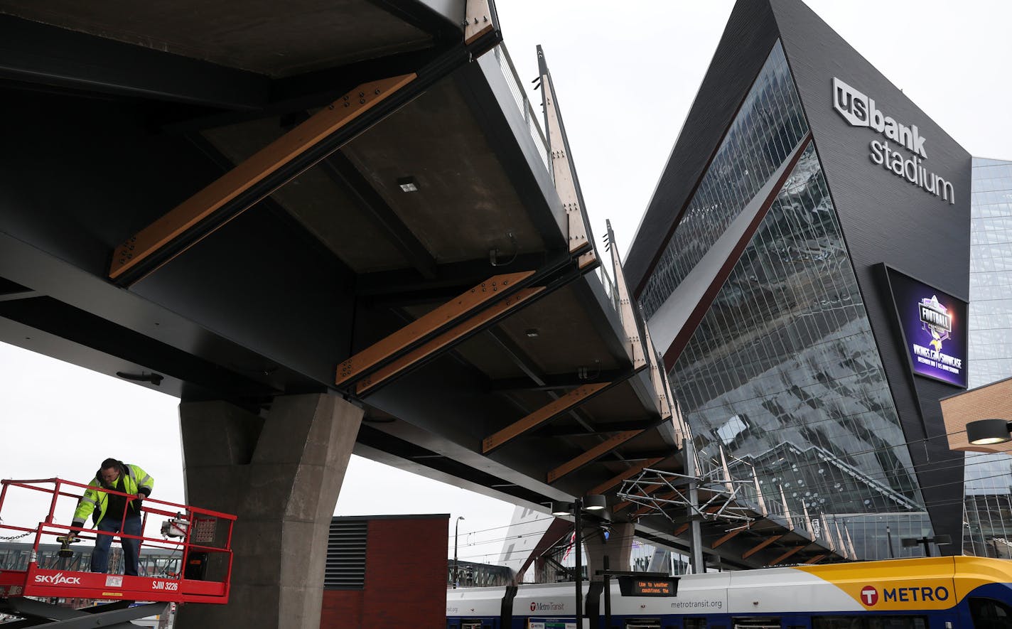 Tim Sibinski of Systems Management & Balancing worked on the snow removal system under the pedestrian bridge to U.S. Bank Stadium on Tuesday.