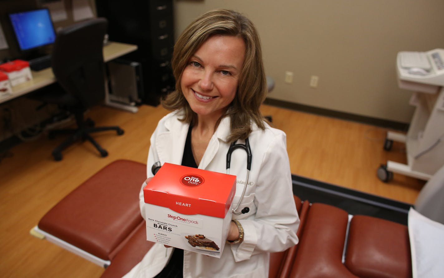 Edina cardiologist Dr. Elizabeth Klodas, a specialist in heart disease prevention, sat with a a new food product line that she helped designed called Step One Foods at her office in Edina Wednesday, February 26, 2014. ] (KYNDELL HARKNESS/STAR TRIBUNE) kyndell.harkness@startribune.com