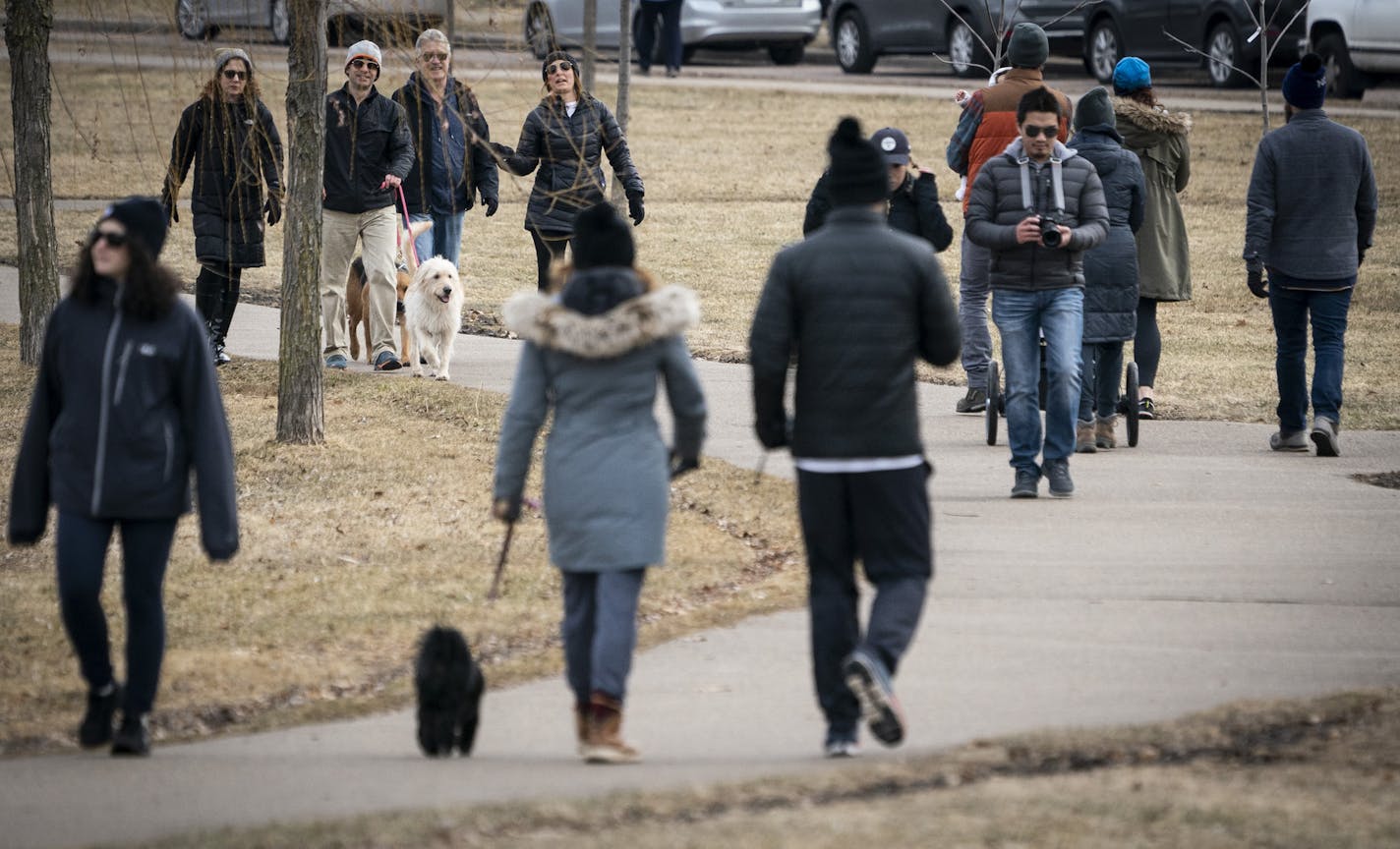 The walking path at Lake of the Isles in Minneapolis, Minn. was full of people out for fresh air on Tuesday, March 17, 2020.