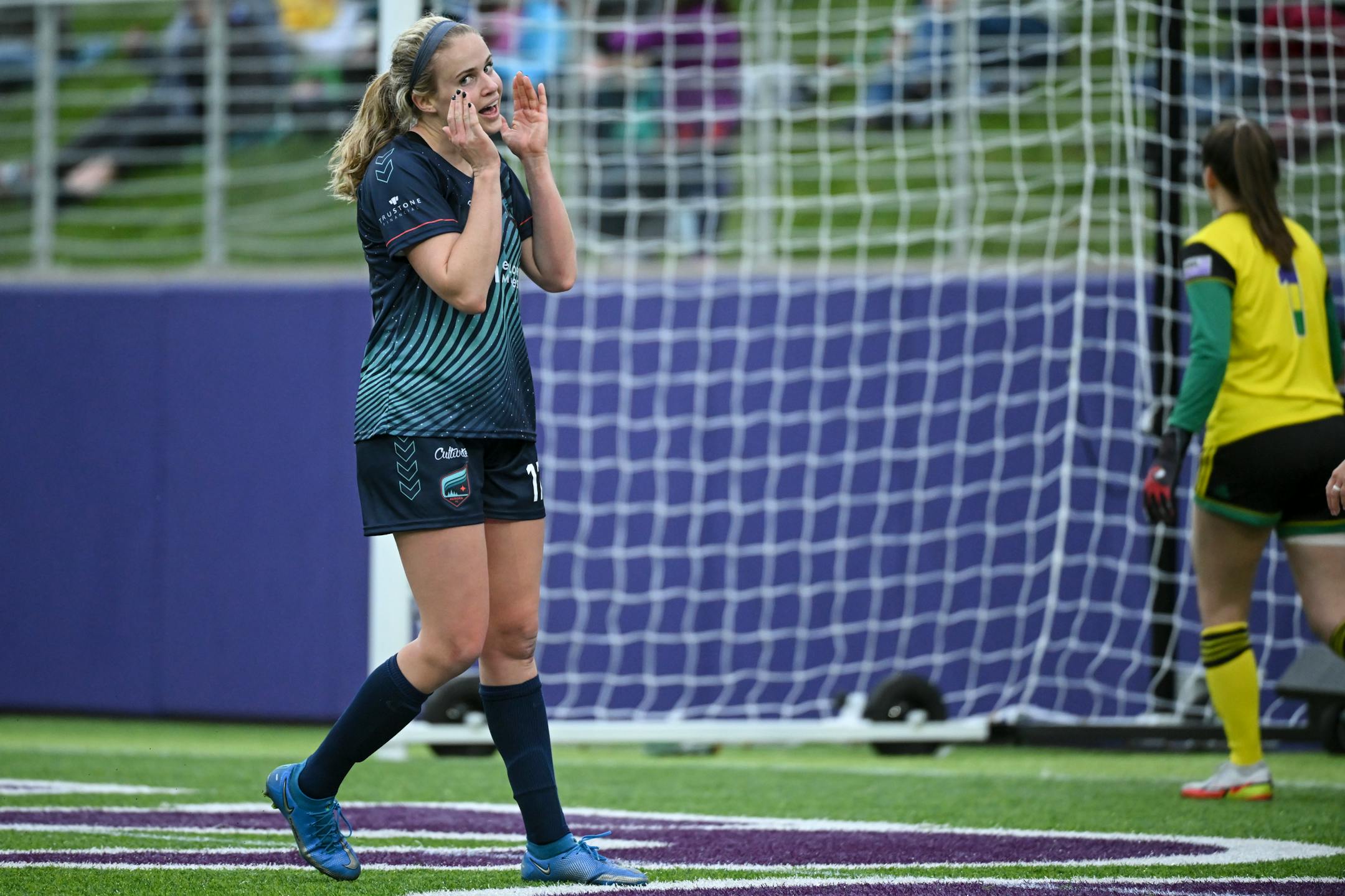 Minnesota's Morgan Turner reacts after missing a goal during the first half of the match.