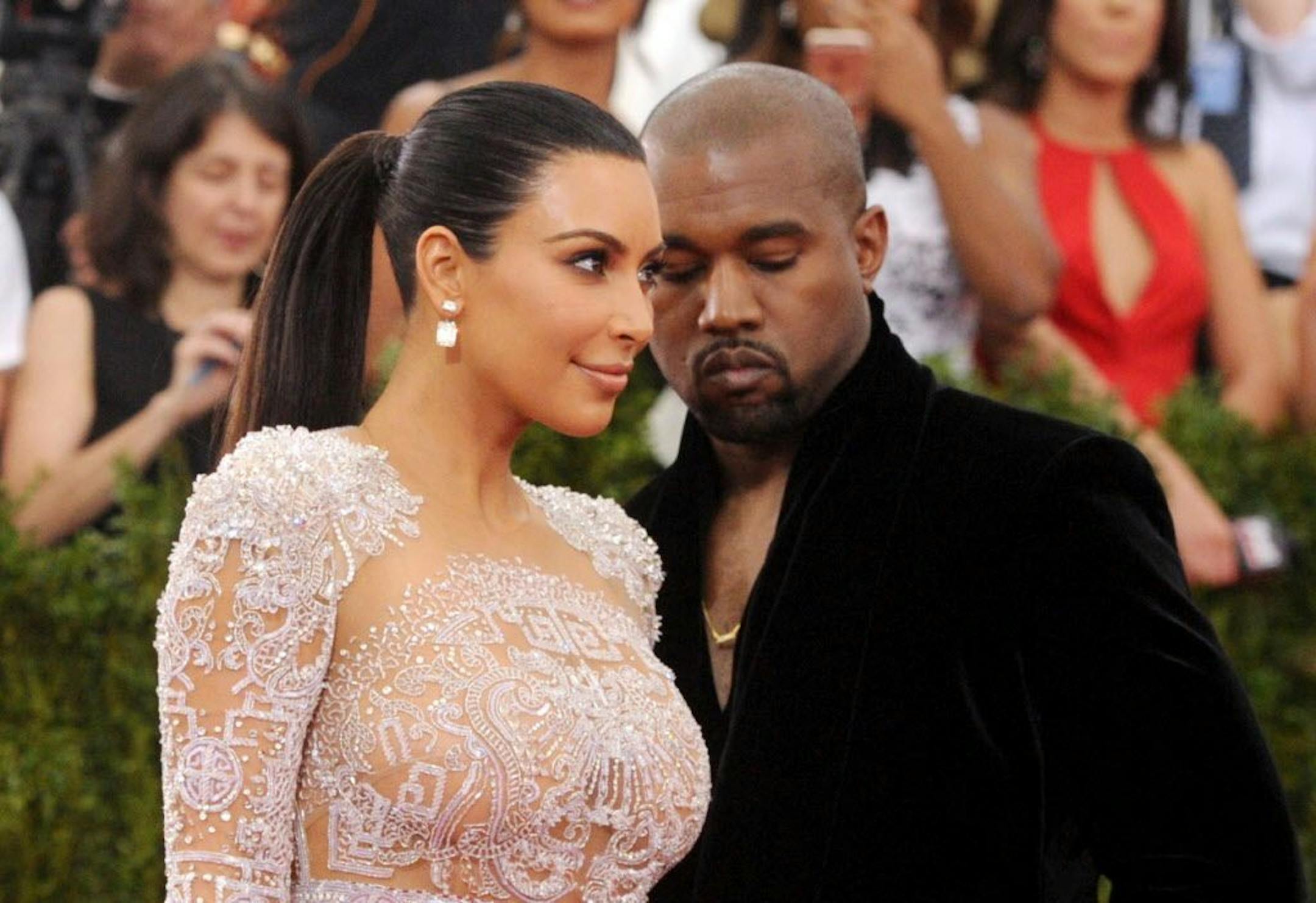 File-This May 4, 2015, file photo shows Kim Kardashian, left, and Kanye West arriving at The Metropolitan Museum of Art's Costume Institute benefit gala in New York. Kardashian says she is pregnant with her second child with West. She revealed the news in a clip that appeared after the Sunday, May 31, 2015, episode of the E! reality show "Keeping Up With the Kardashians."