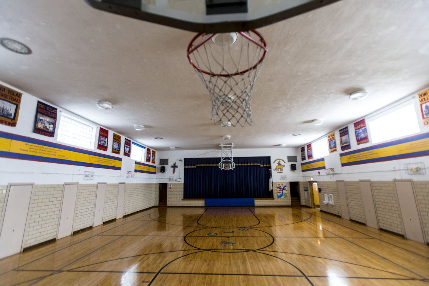 Central Lutheran's empty gym is filled with banners from sports team victories over the last thirty years.